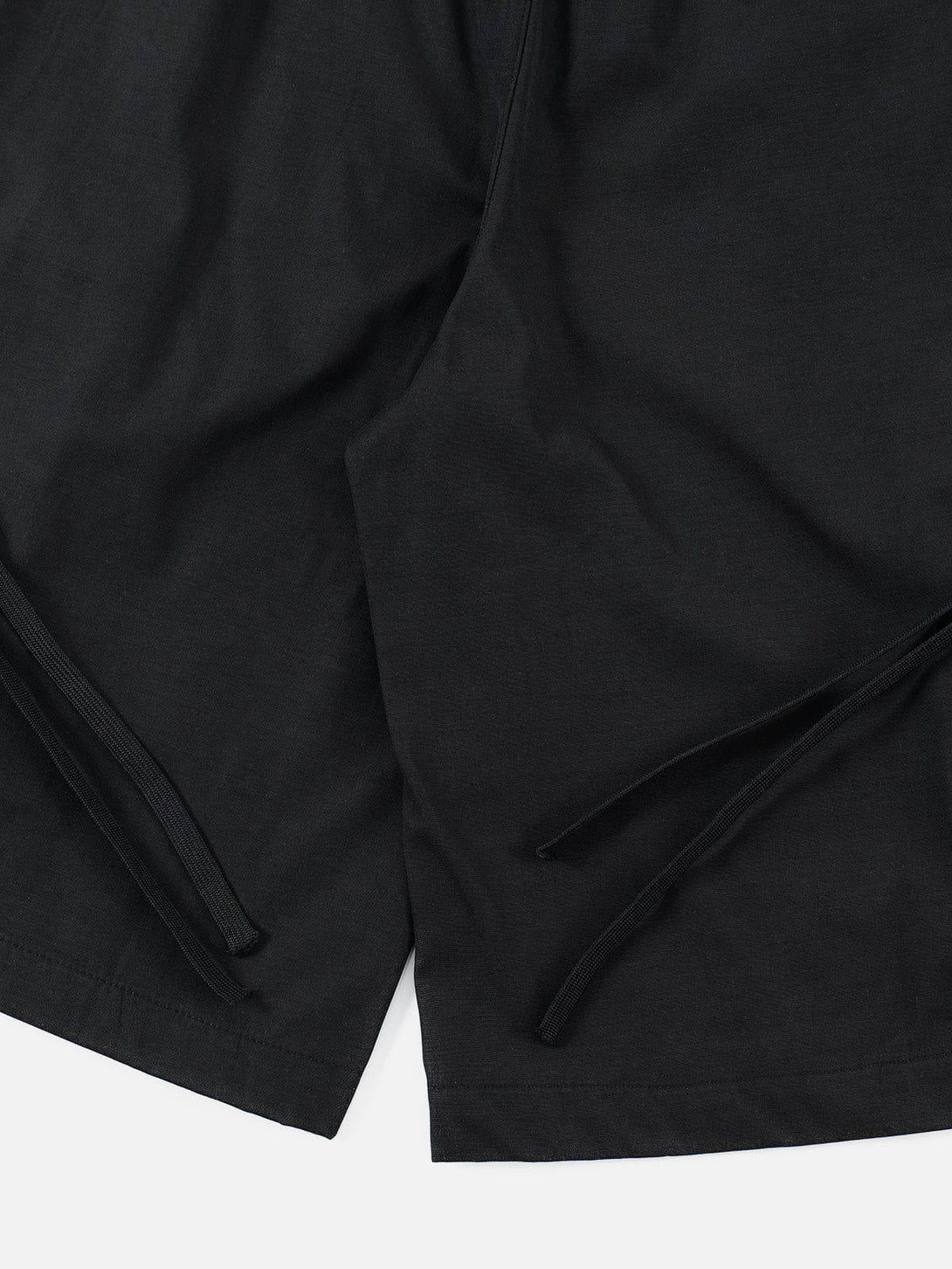 Zoomed-in view showcasing the TALISHKO black 3D big pocket shorts' intricate details.