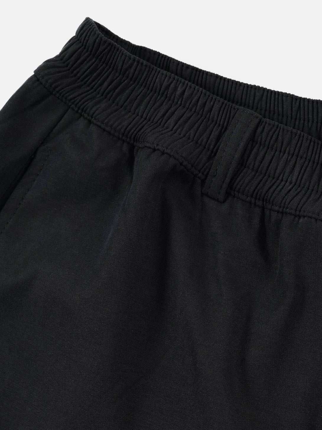 Intricate look at the waistband detail of TALISHKO 3D big pocket shorts, highlighting texture.