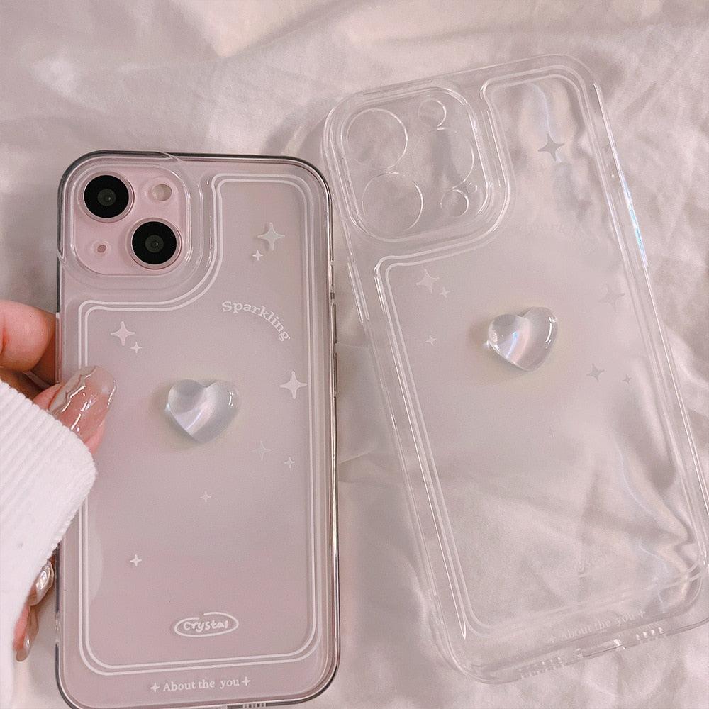 A TALISHKO iPhone case highlights a 3D heart with subtle star details on a clear background.