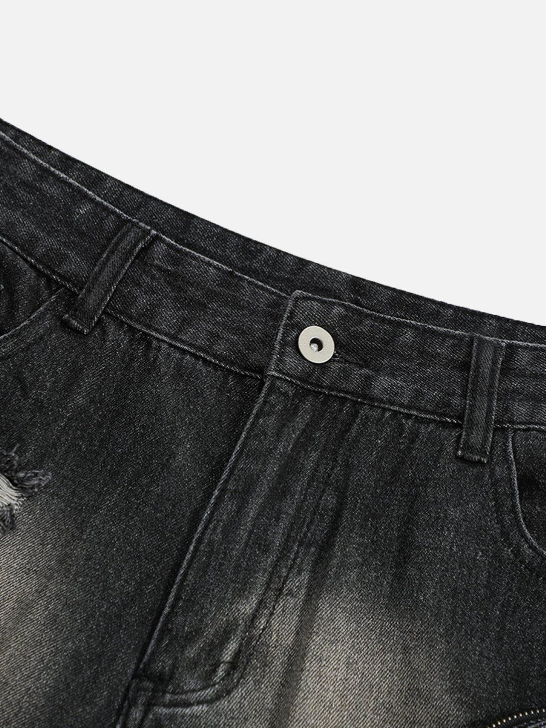 Close-up of TALISHKO's 3D multi-pocket washed jorts, highlighting their textured denim detail.