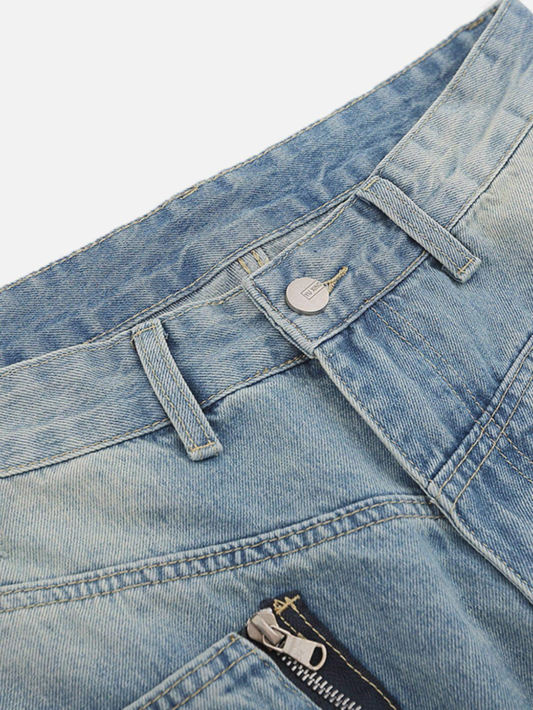 A detailed view of TALISHKO jeans highlighting the waistband and 3D zip-up pocket design.