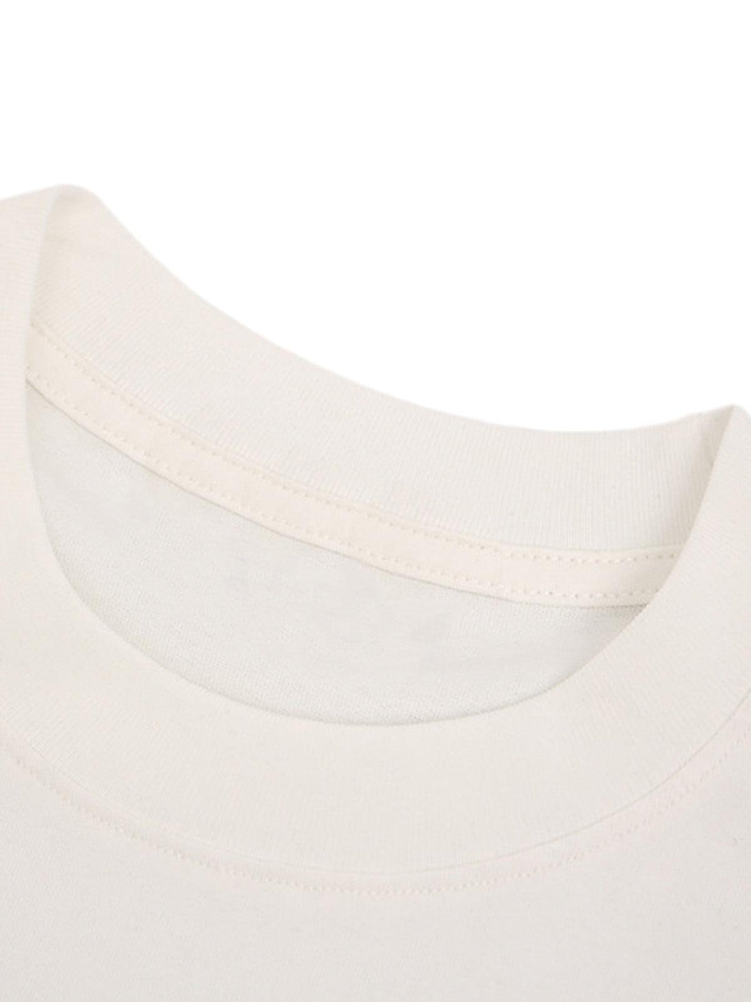 Focusing on the neckline of a TALISHKO T-shirt, highlighting soft fabric and quality stitching.
