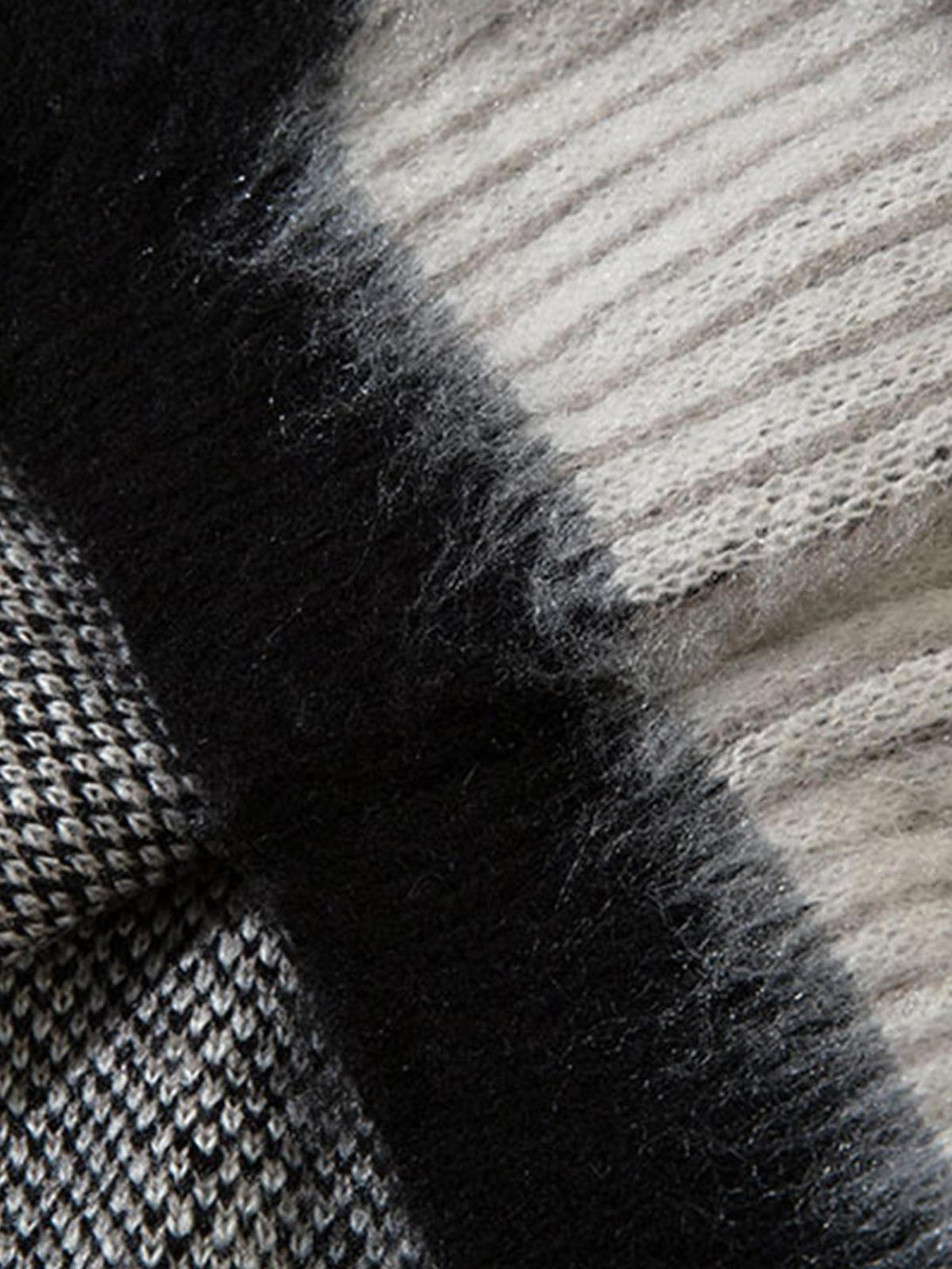Zoomed-in texture of TALISHKO's mohair sweater, highlighting its abstract pattern and softness.