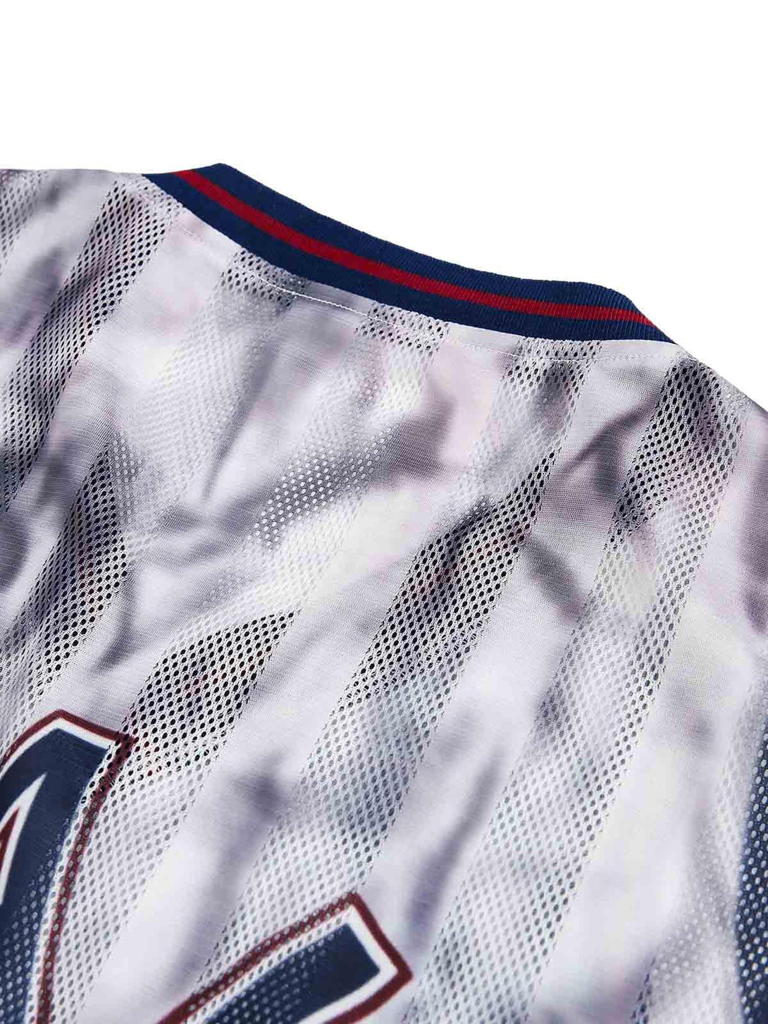 Intricate look at TALISHKO All-Star jersey T-shirt, showcasing mesh texture and striped neckline.