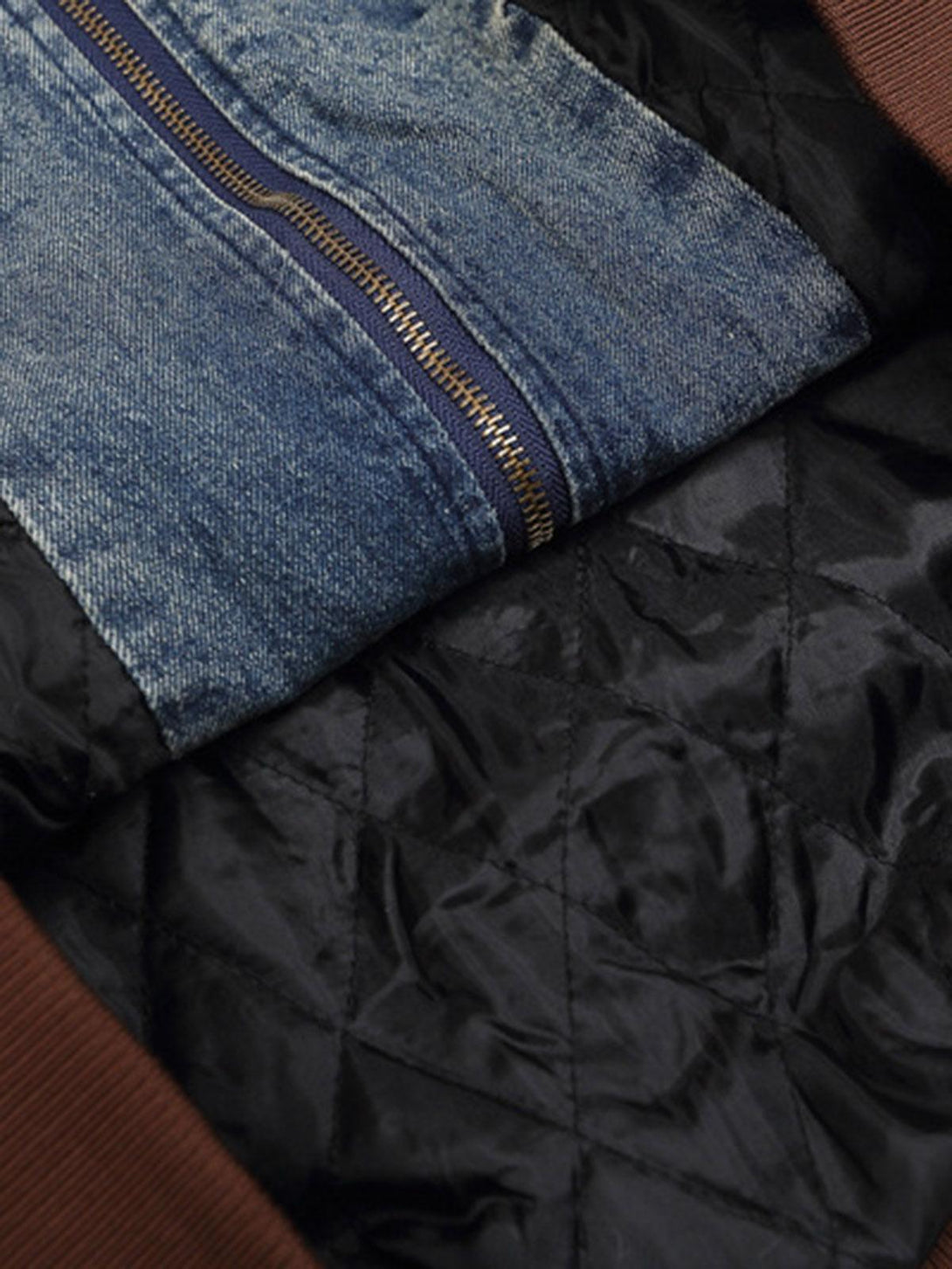 A detailed view of the TALISHKO jacket's inner quilted lining and denim zipper design.