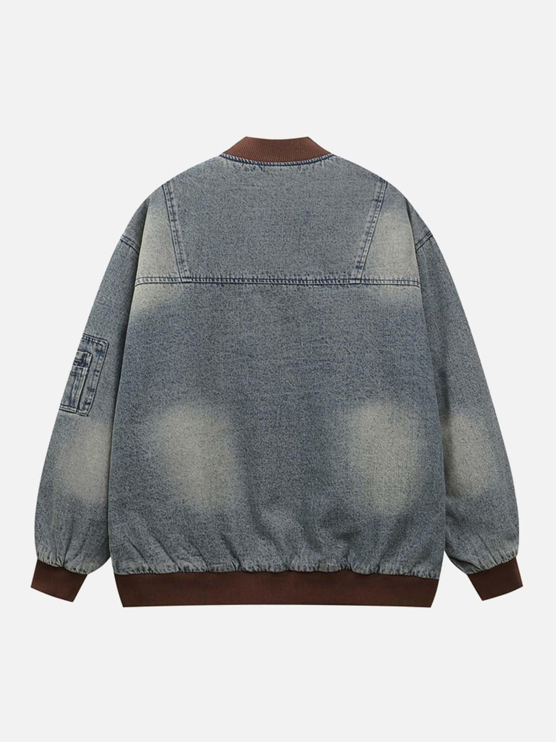 Back view of TALISHKO denim bomber jacket with quilted texture and embroidered details.