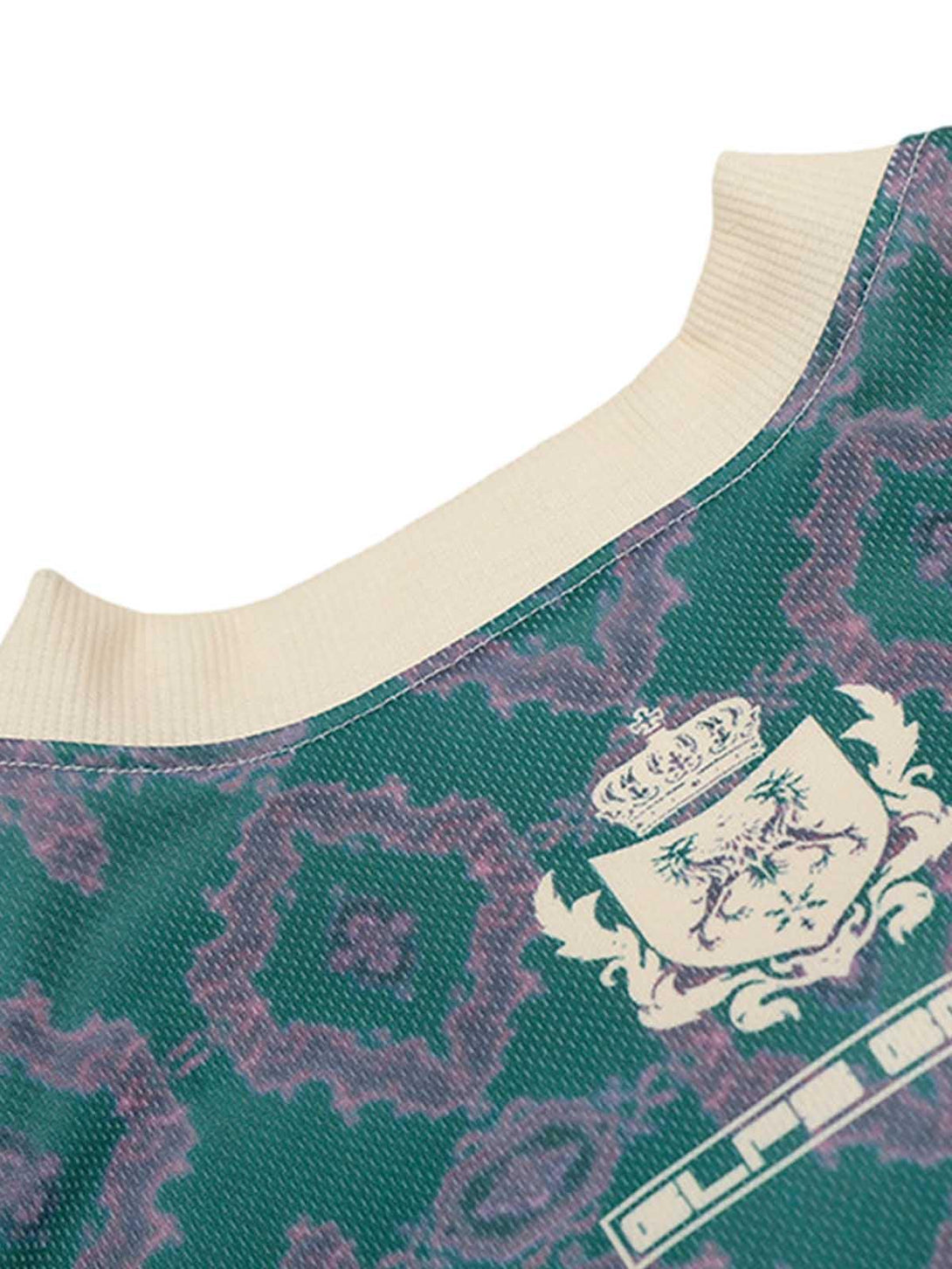 "Intricate look at the green patterned V-neck jersey T-shirt by TALISHKO, showcasing unique details."