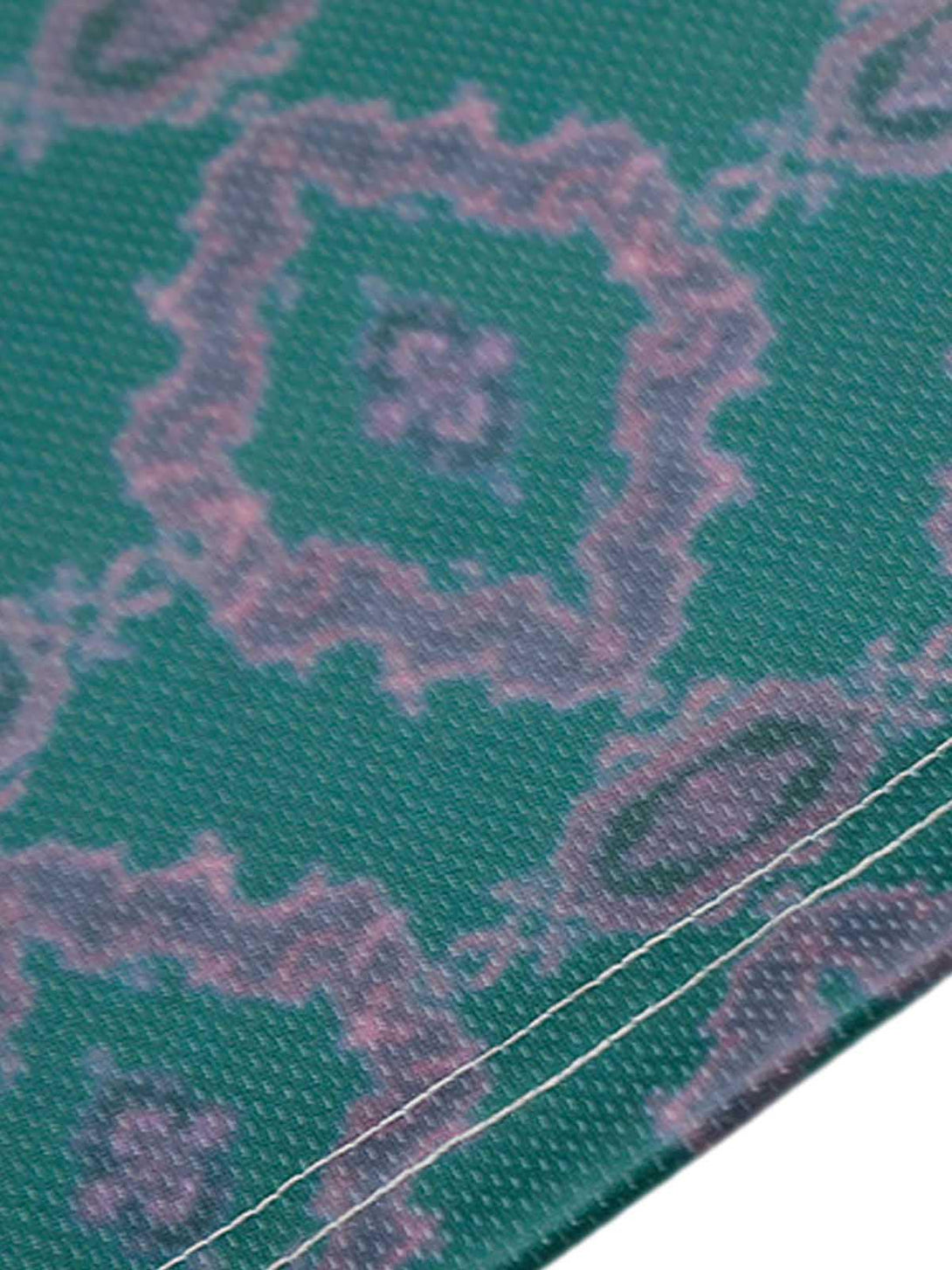 Zoomed-in texture of TALISHKO's green patterned jersey, highlighting unique fabric details.