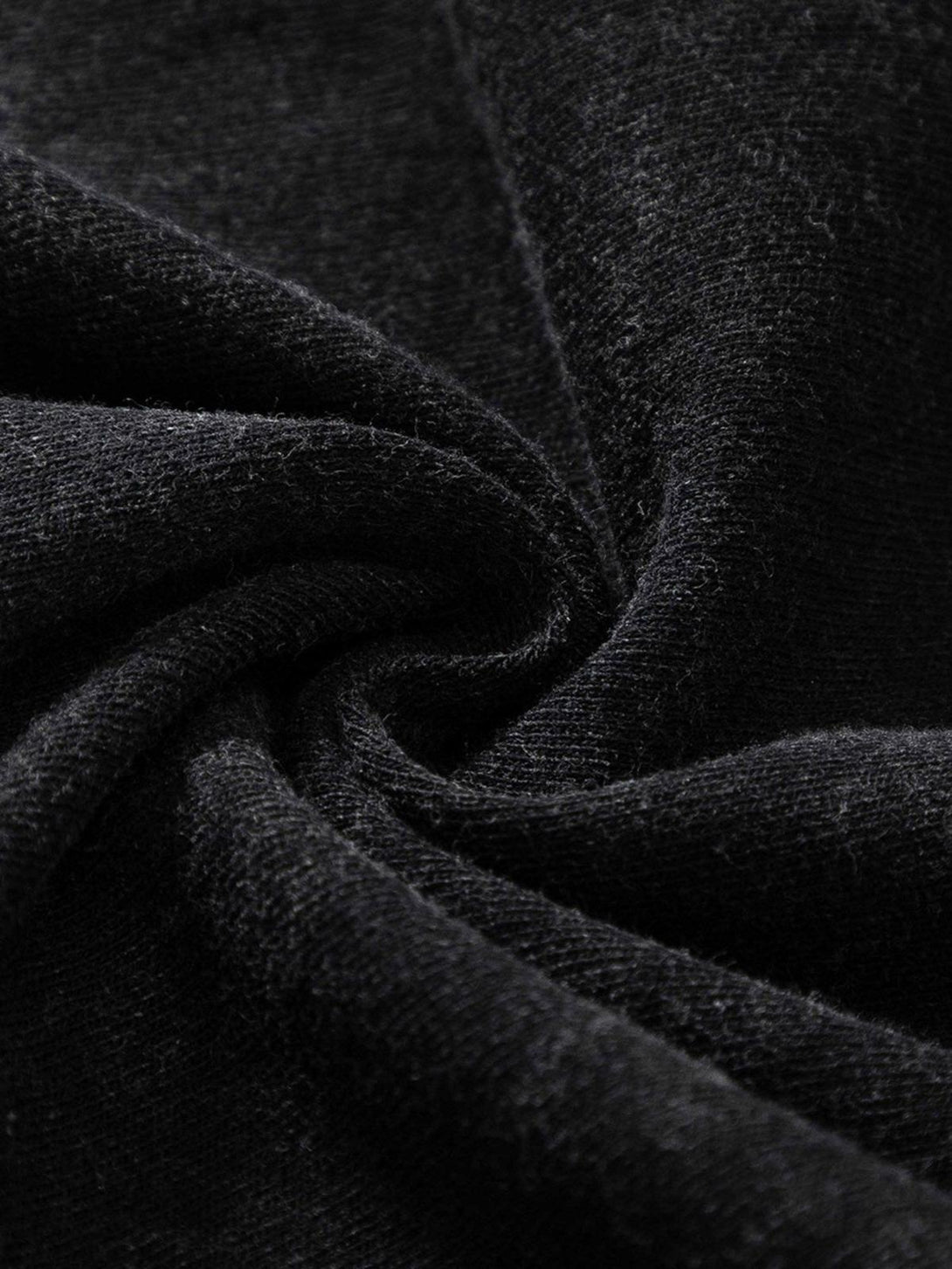 A tight crop highlighting the textured fabric of TALISHKO's abstract print T-shirt.