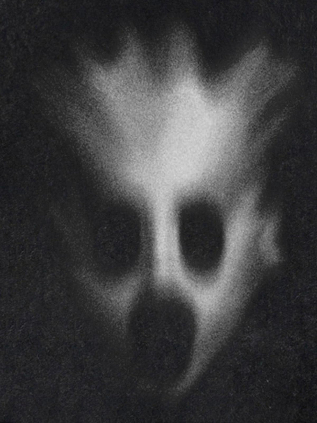 A mysterious abstract design featured on TALISHKO's T-shirt, capturing unique artistic flair.