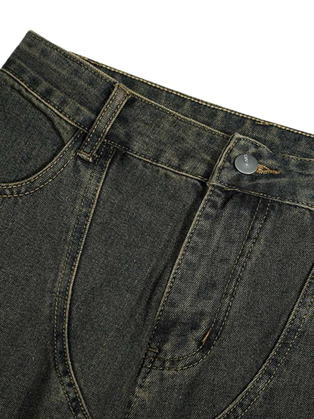 Focusing on TALISHKO's distressed jeans, showcasing detailed stitching and button detail.