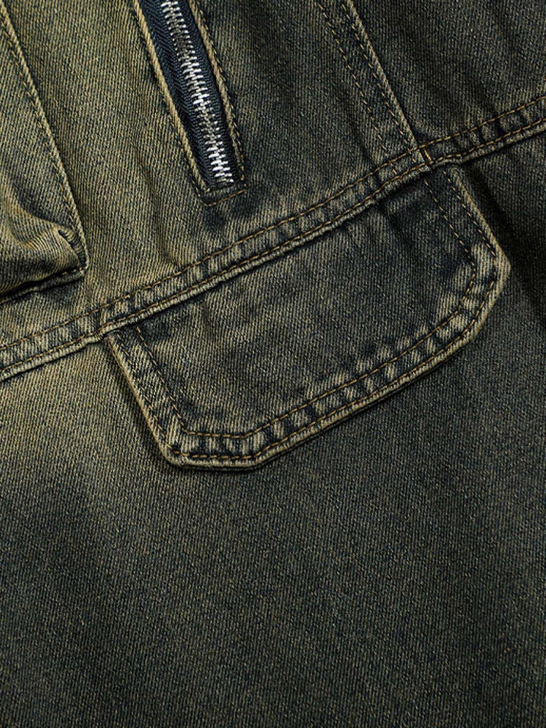 Zoomed-in texture of TALISHKO's jeans pocket, highlighting stitching and zipper details.