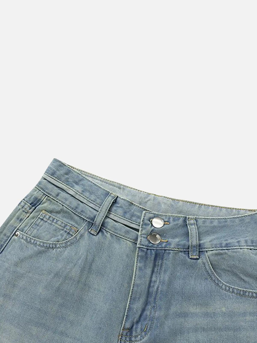 A close-up of TALISHKO vintage jeans, highlighting the unique gradient bleach wash design.