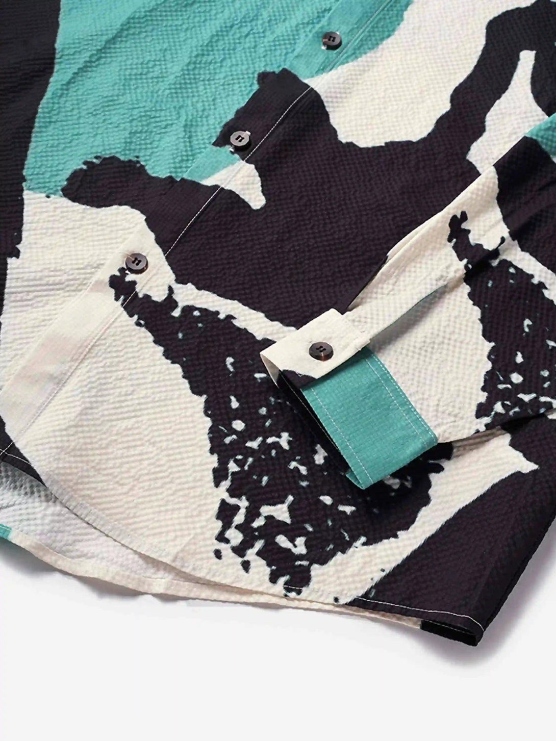 Intricate look at TALISHKO's abstract seersucker shirt, highlighting bold patterns and texture.