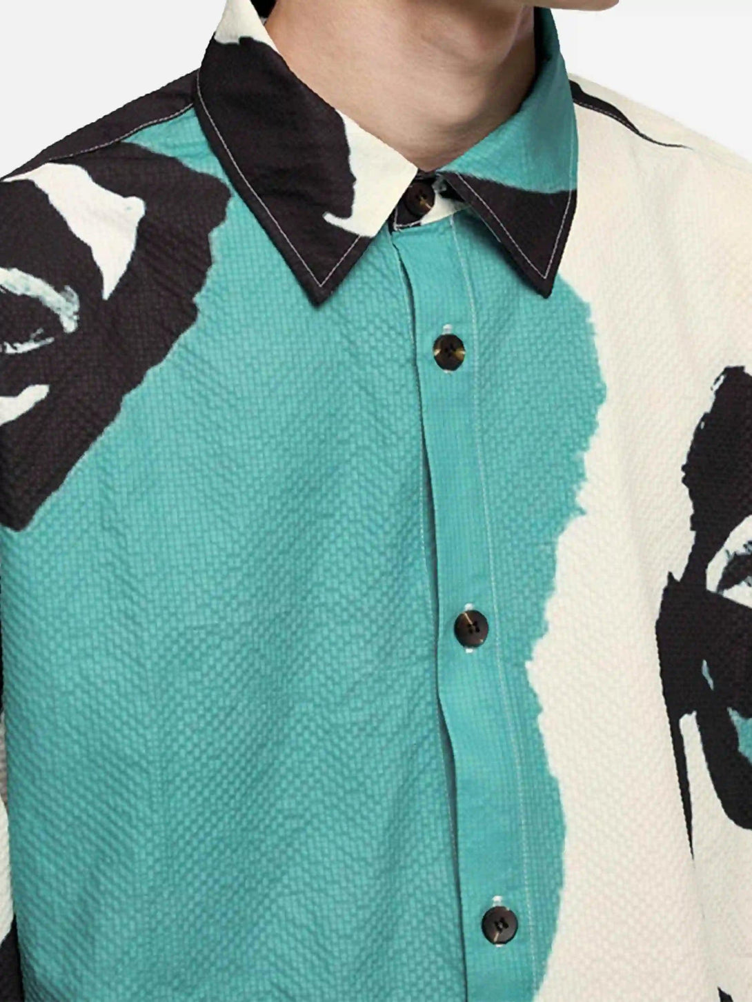 A detailed view of TALISHKO's abstract seersucker shirt, highlighting its unique patterns.