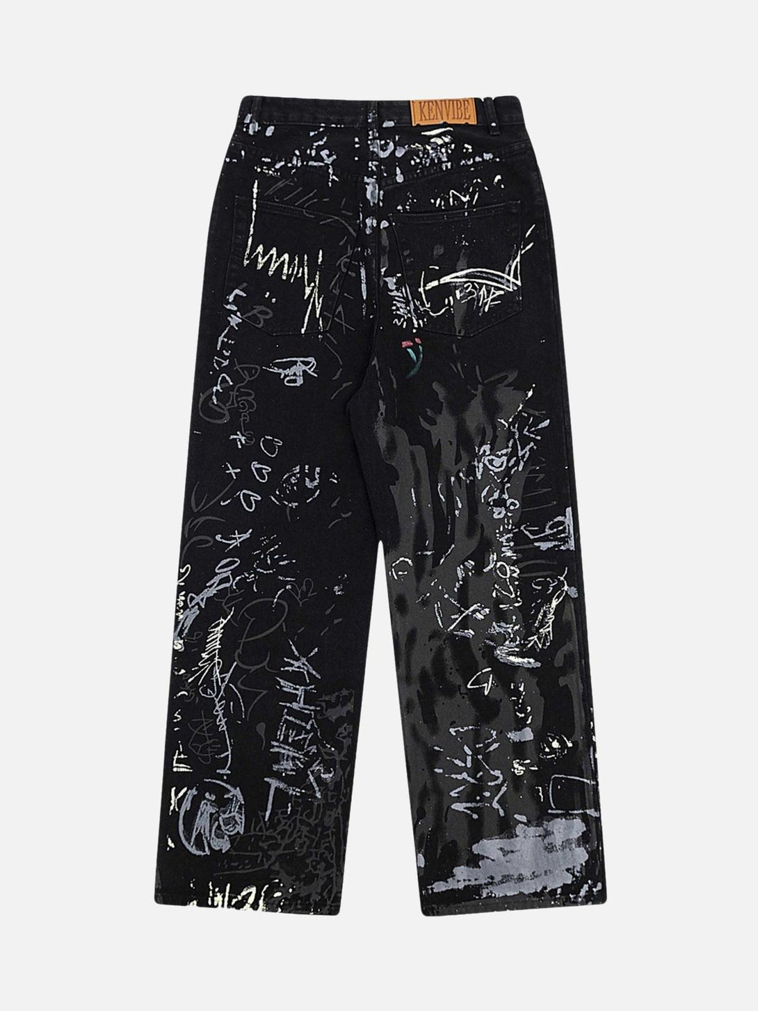 Back view of graffiti-print jeans by TALISHKO, highlighting artistic streetwear flair.