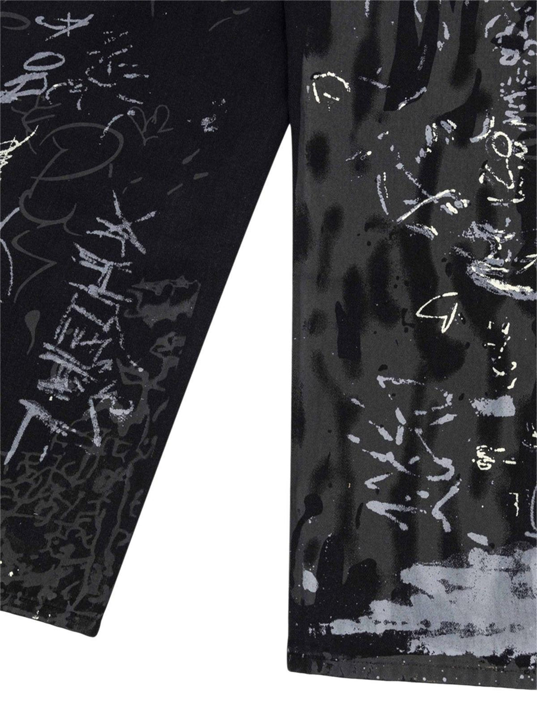 Zoomed-in texture of graffiti print on TALISHKO jeans, showcasing artistic streetwear flair.
