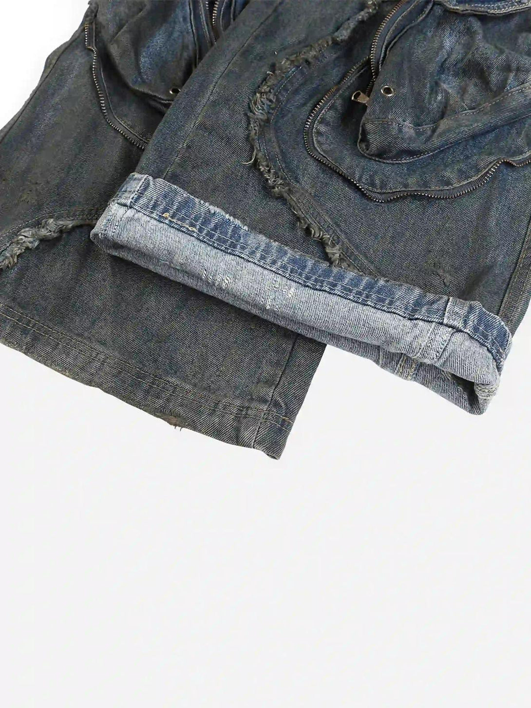 A close-up of TALISHKO work jeans, highlighting distressed edging and rugged texture.