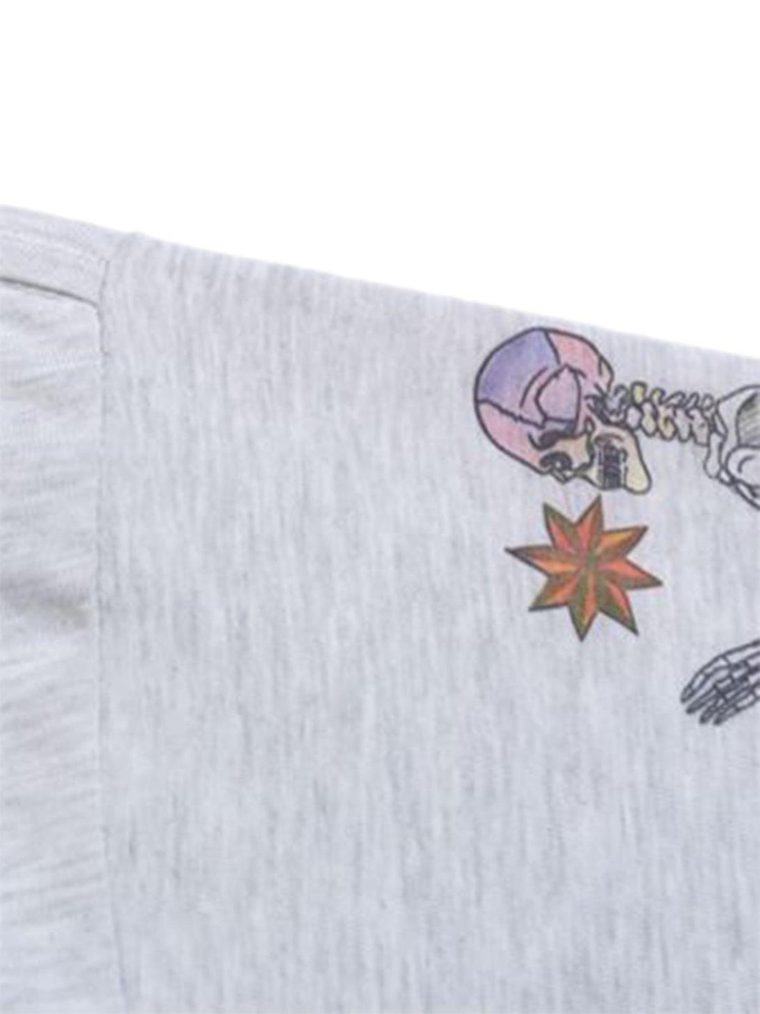 A close-up of the TALISHKO long sleeve T-shirt, highlighting colorful graffiti details on the shoulder.