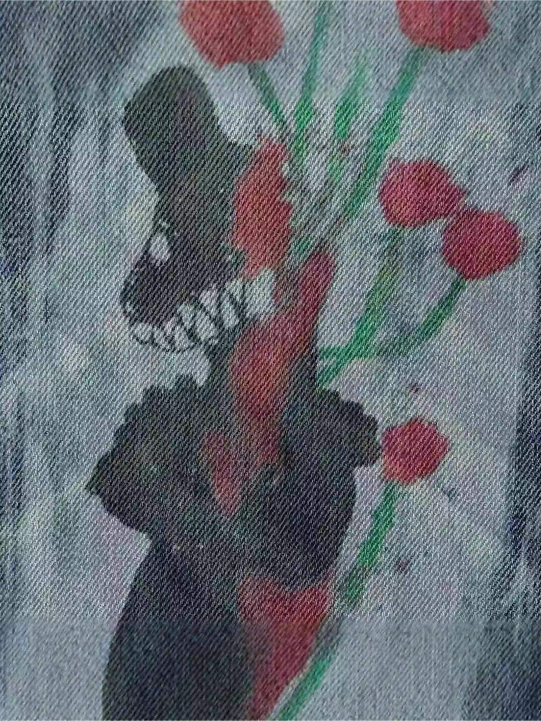 A creative graffiti design on jeans by TALISHKO, highlighting artistic flair and unique style.