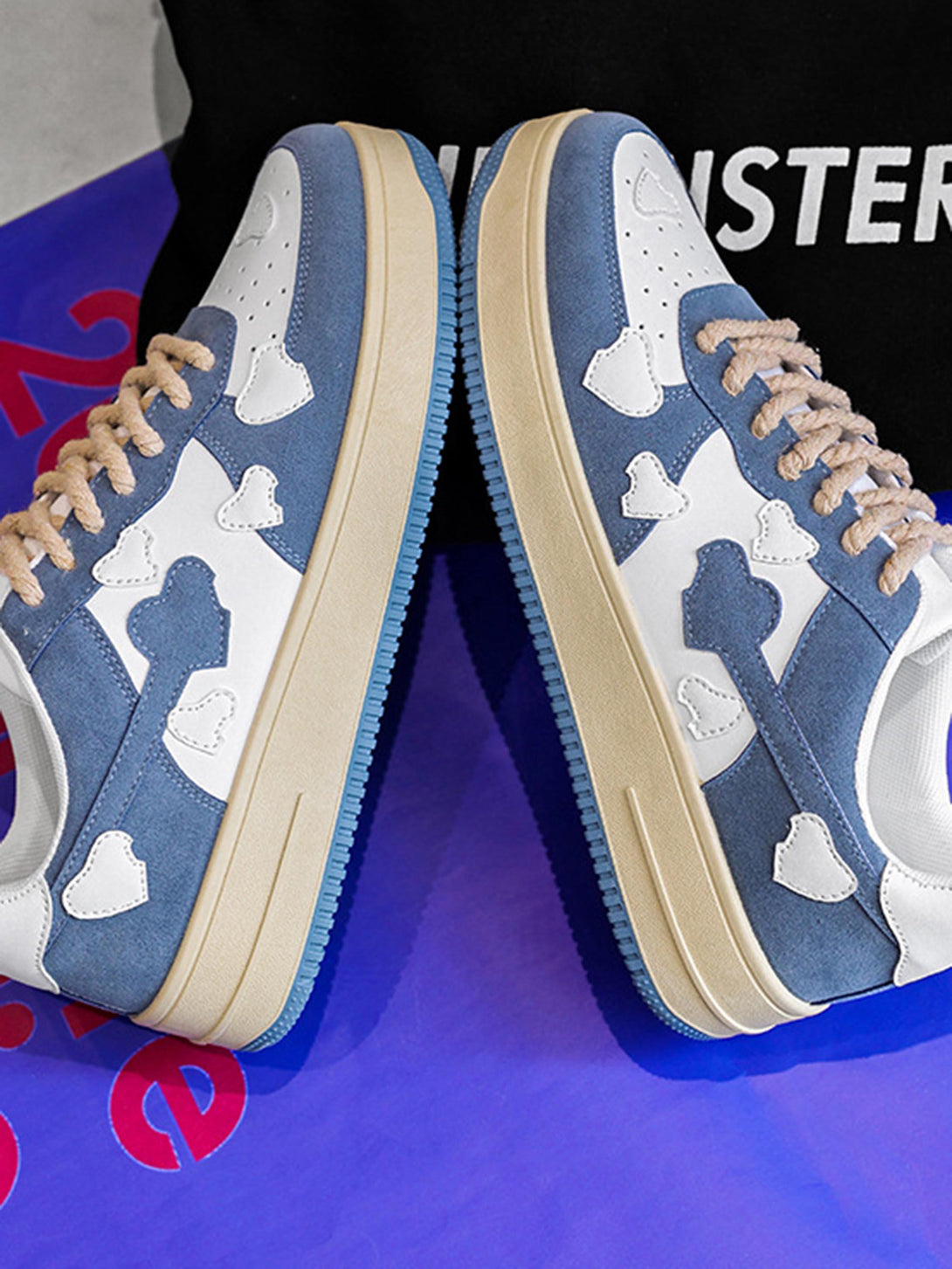 TALISHKO retro sneakers in blue and white with cloud patterns, featuring textured rope laces.