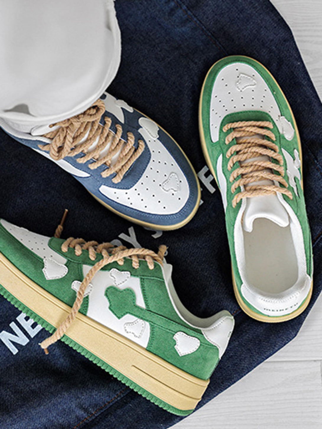 Green and white retro sneakers by TALISHKO with cloud patterns and rope laces, side view.