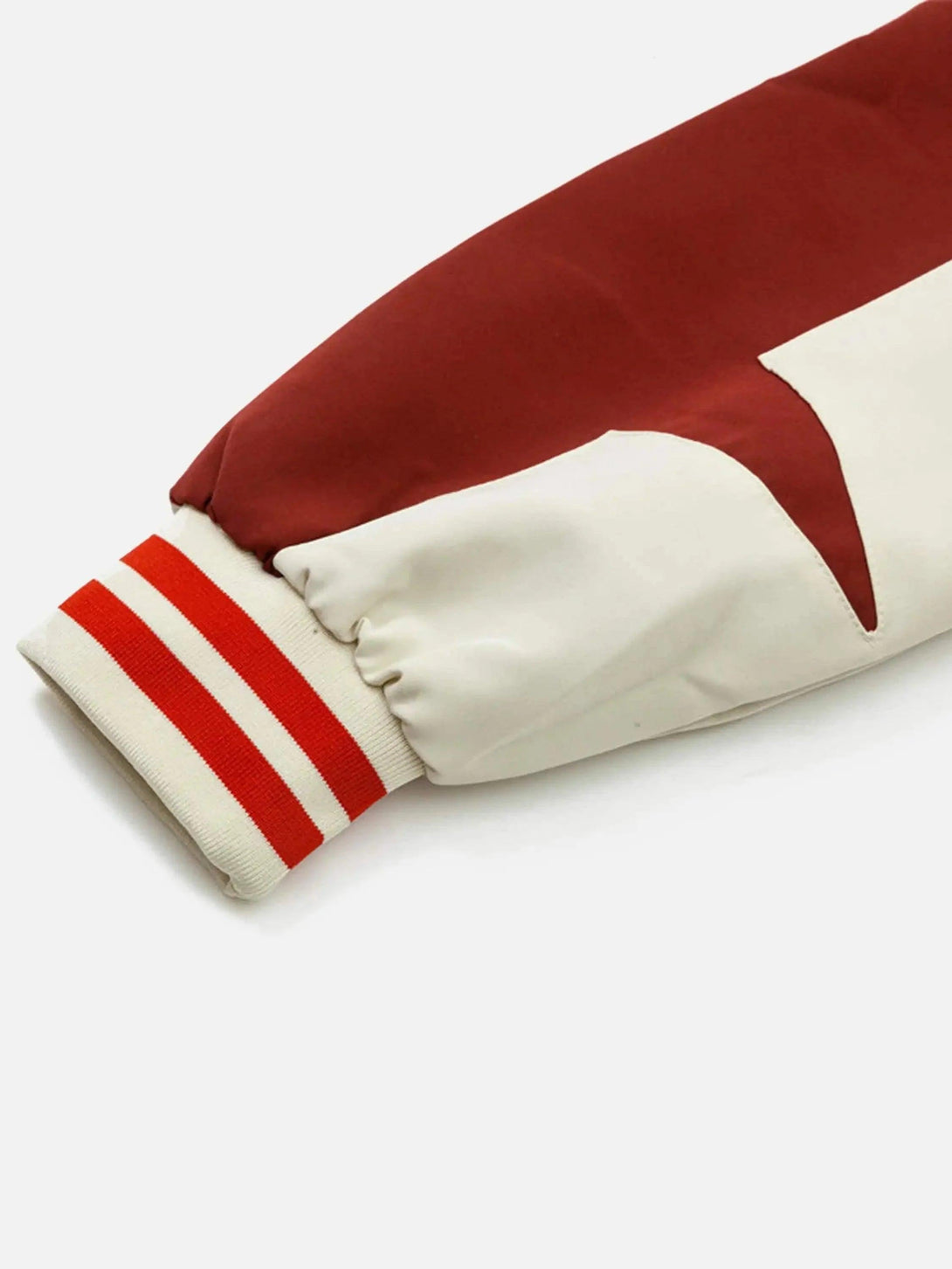 TALISHKO baseball jacket sleeve detail featuring red and white stripes, highlighting athletic style.