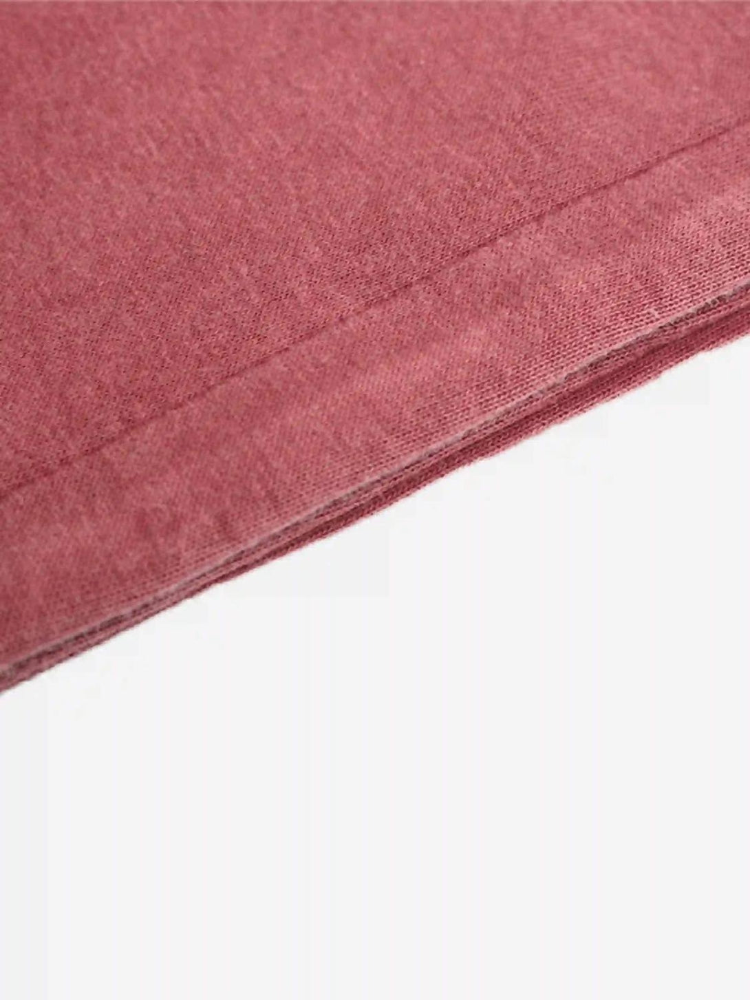 Detailed fabric and stitching on a red TALISHKO hoodie, highlighting its soft texture.