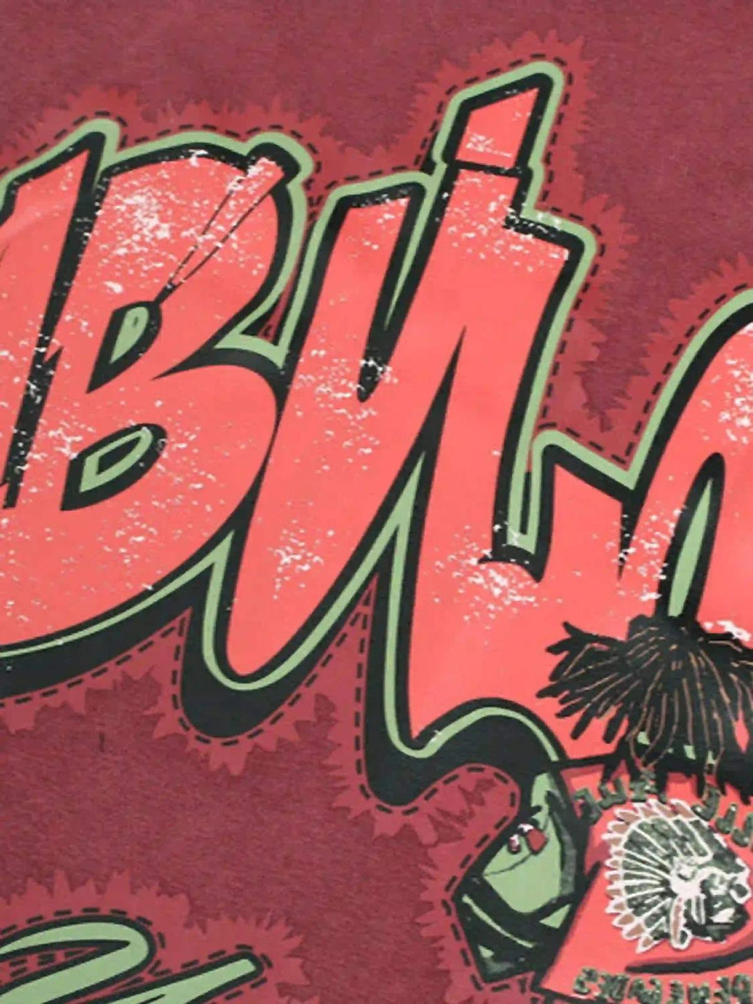 Zoomed-in view of TALISHKO hoodie showcasing bold graffiti design and distressed texture.