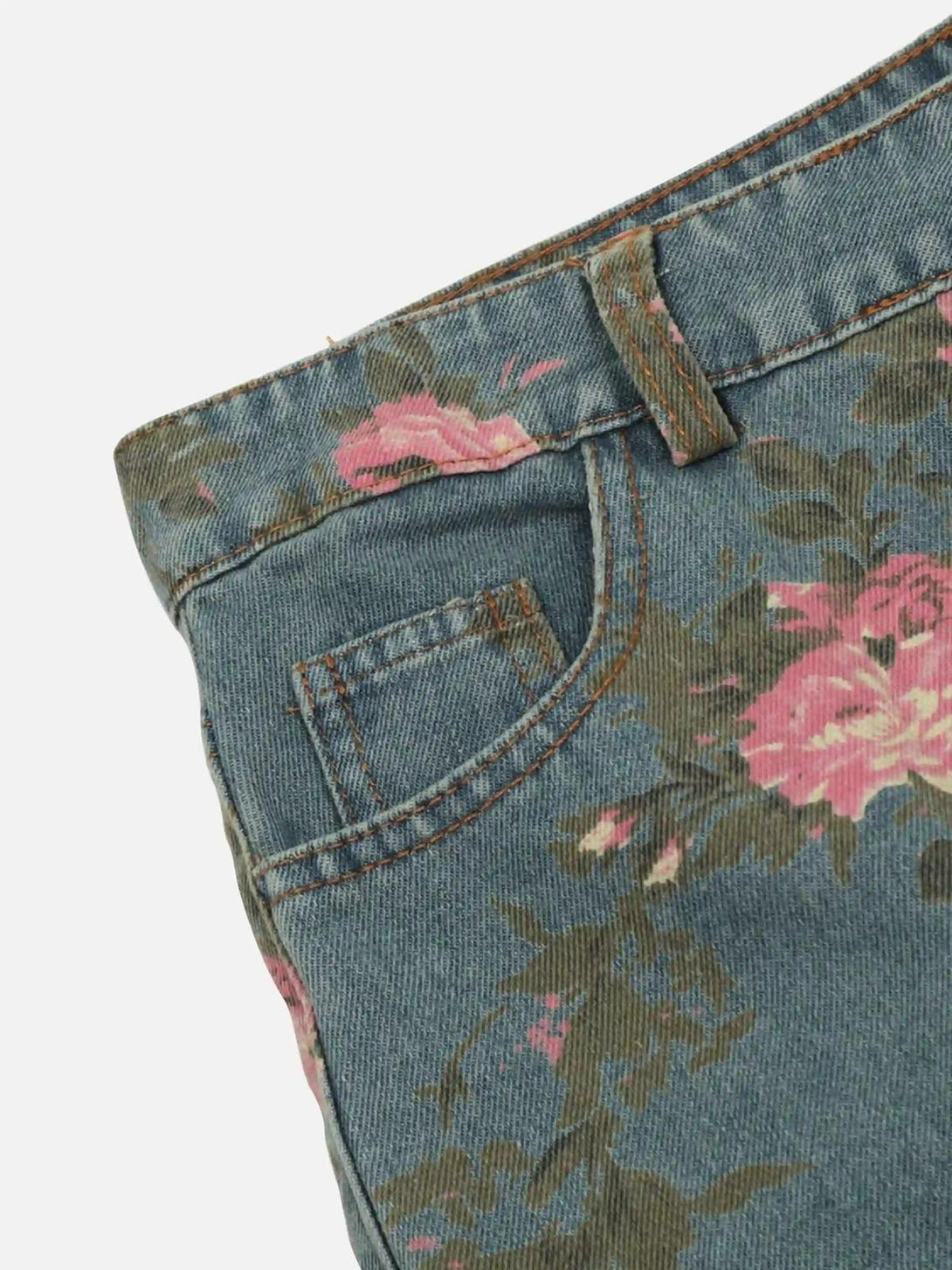 Intricate look at TALISHKO's vintage floral rose jeans, highlighting unique denim details.