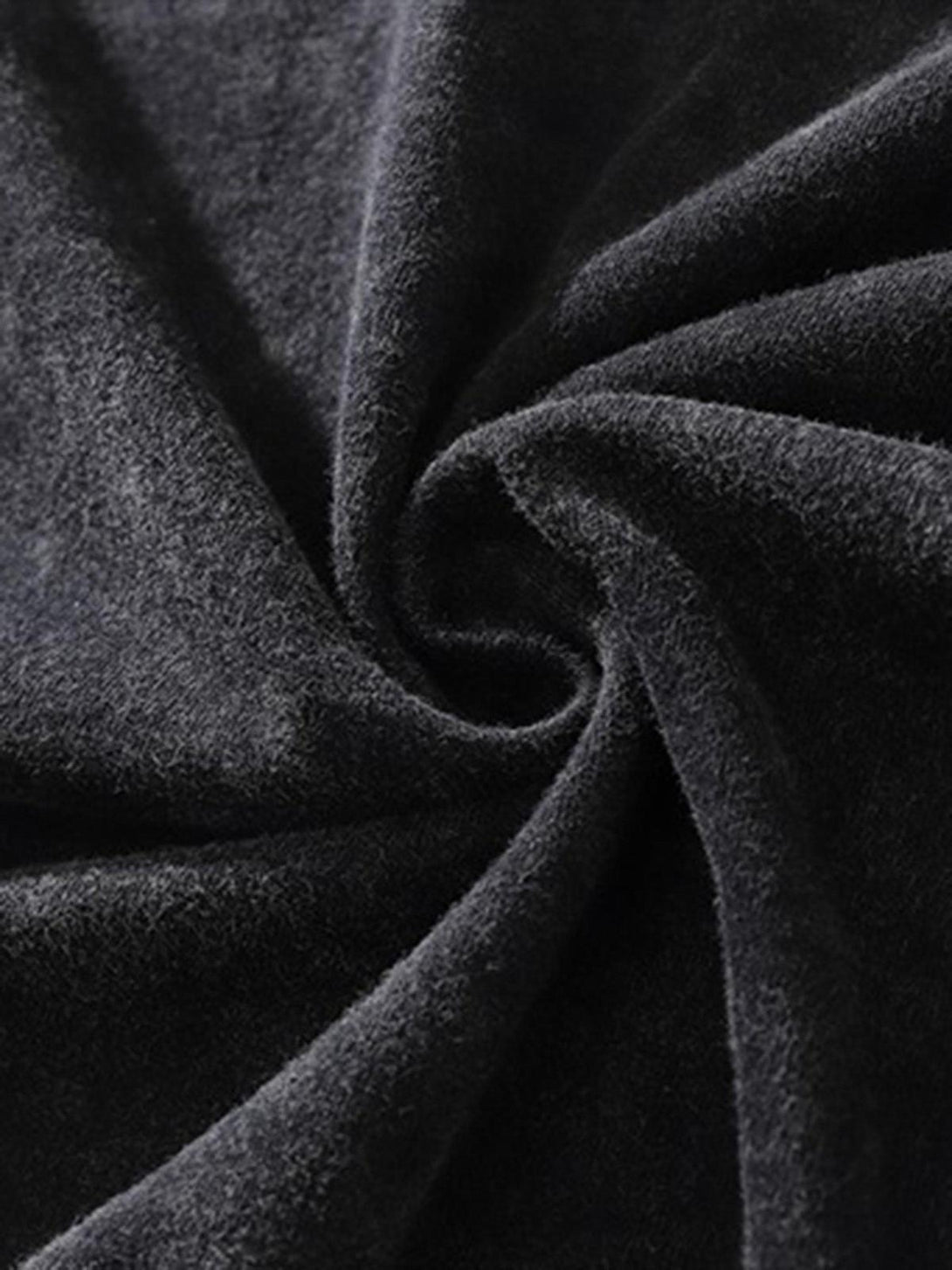 Zoomed-in texture of a TALISHKO hip-hop T-shirt, emphasizing the soft, plush fabric.