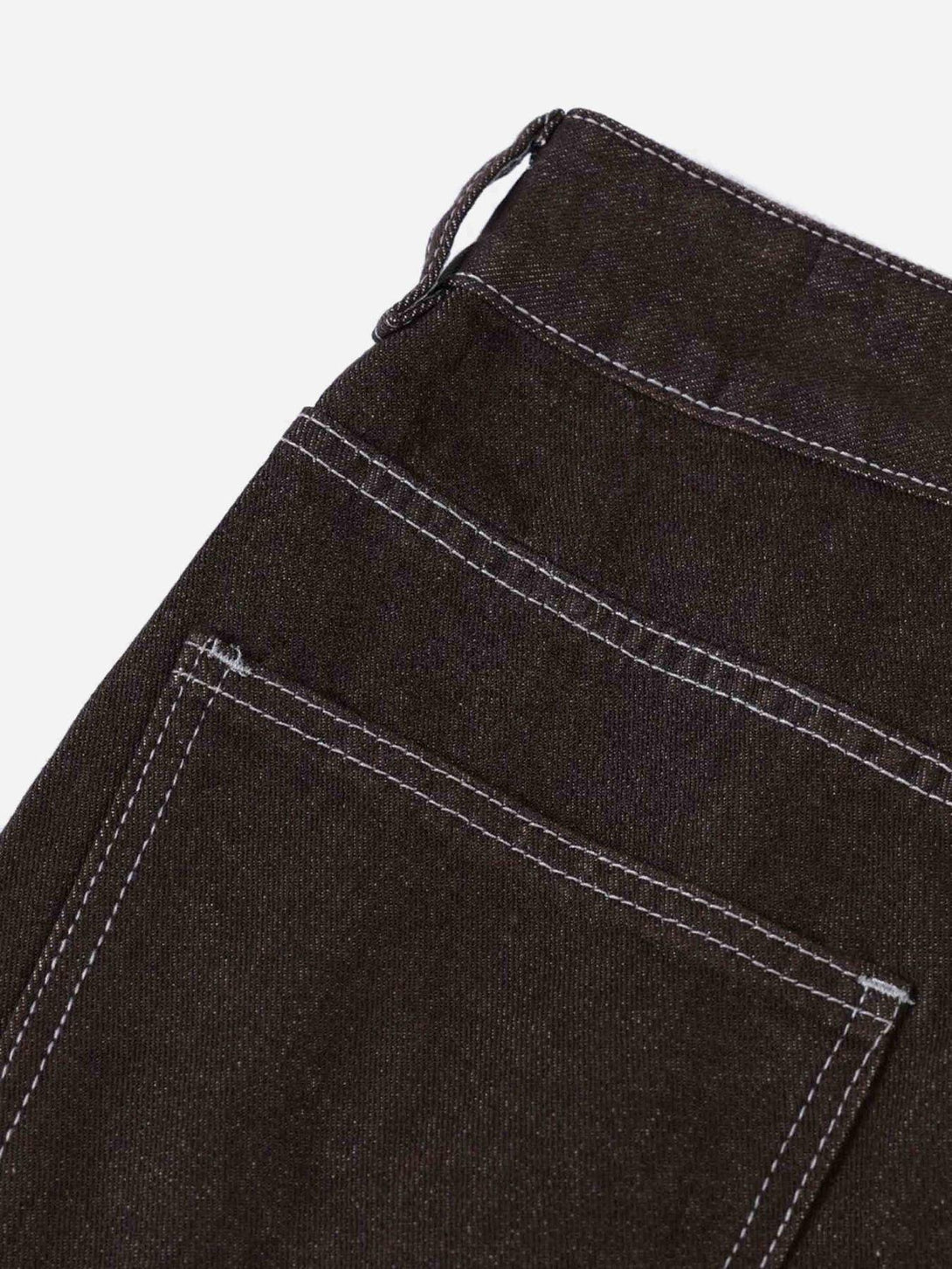 Detailed fabric and stitching of TALISHKO jeans, showcasing a close-up of the pocket design.