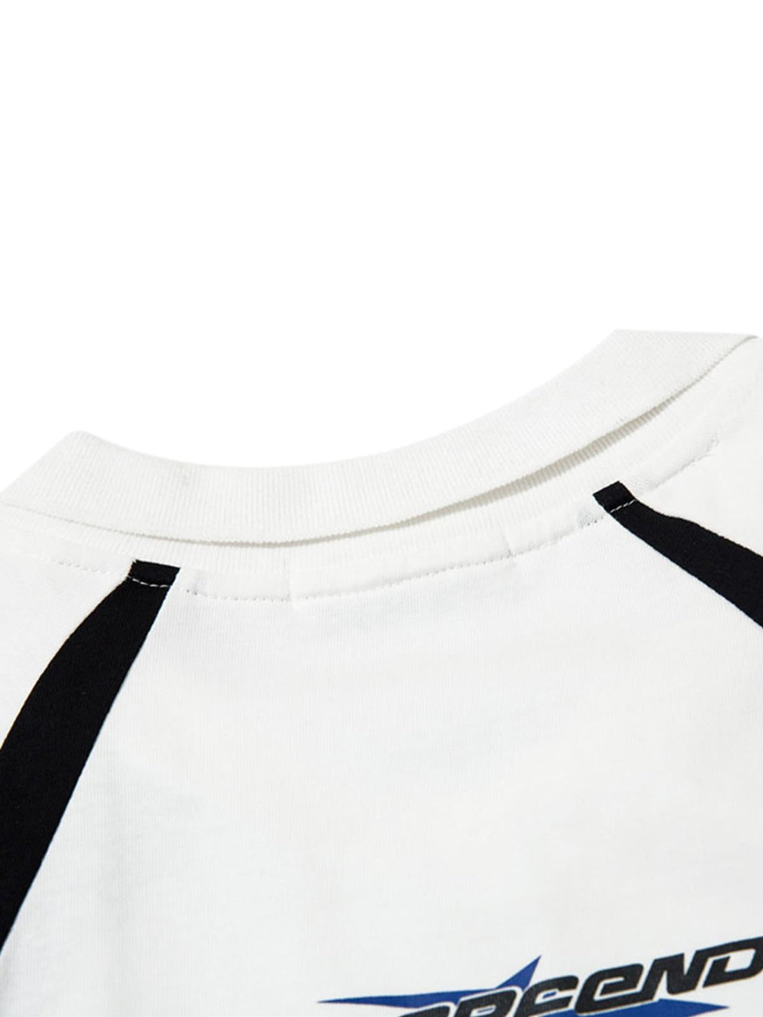 Detailed view of TALISHKO's T-shirt neckline, showcasing black and white contrast design.