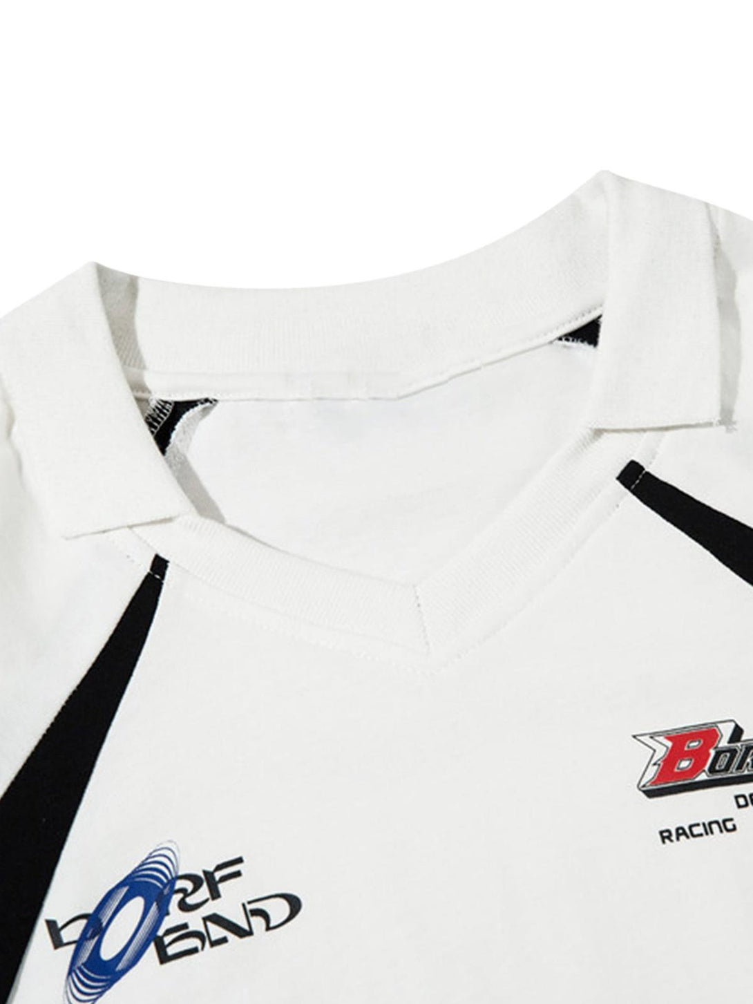 A tight crop highlighting TALISHKO's vintage lapel T-shirt with bold graphic designs.