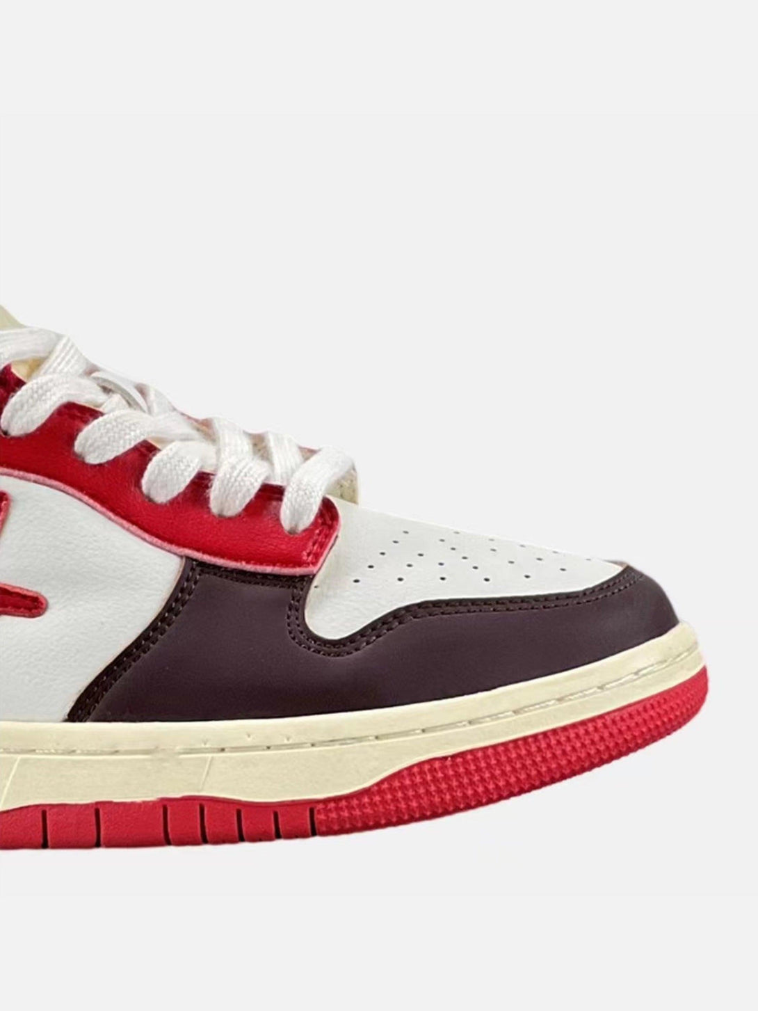 Side view of TALISHKO American retro sneakers in red and white, showcasing bold color contrasts.