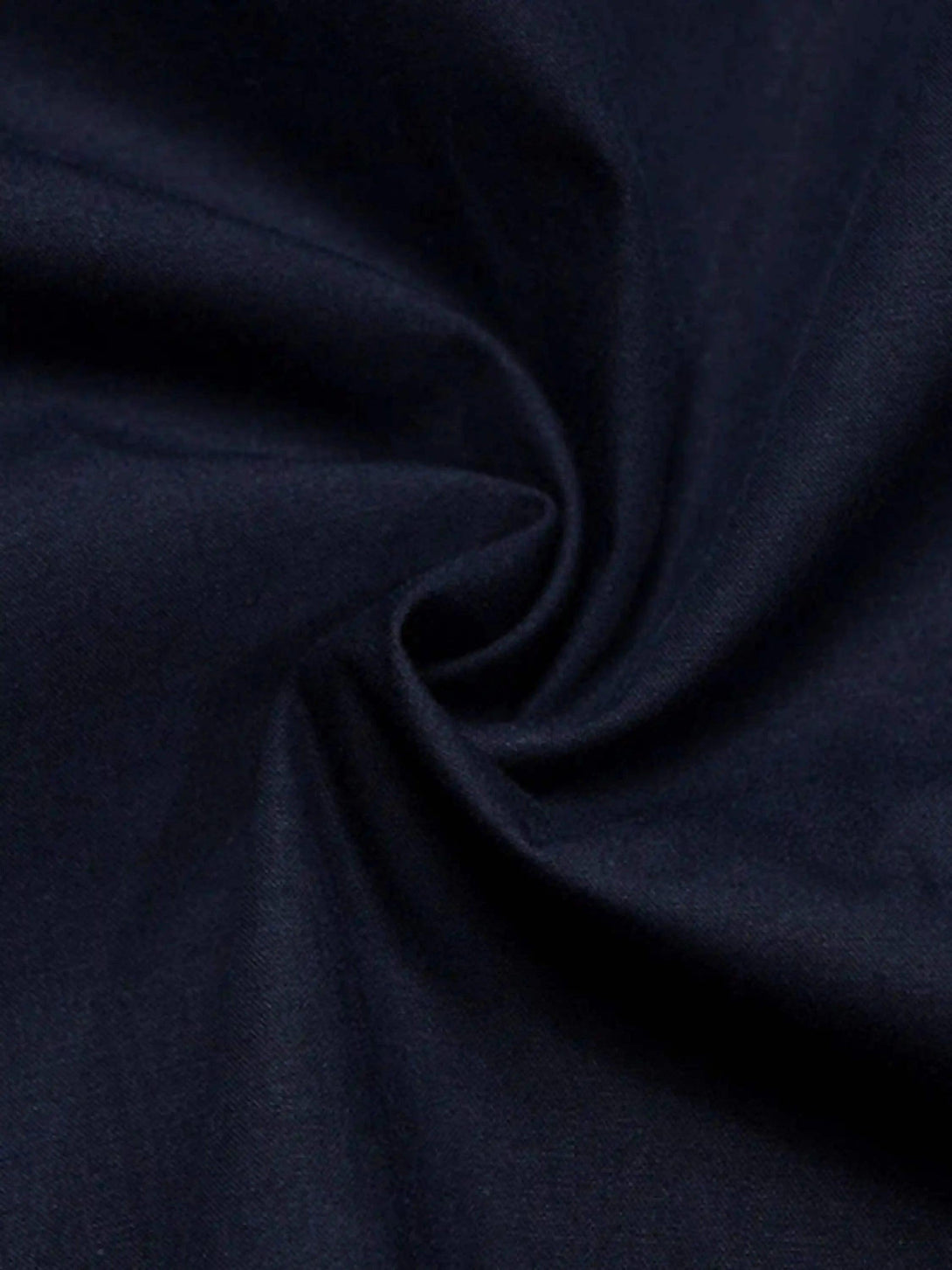 Smooth navy fabric texture of TALISHKO's long-sleeved shirt, highlighting quality materials.