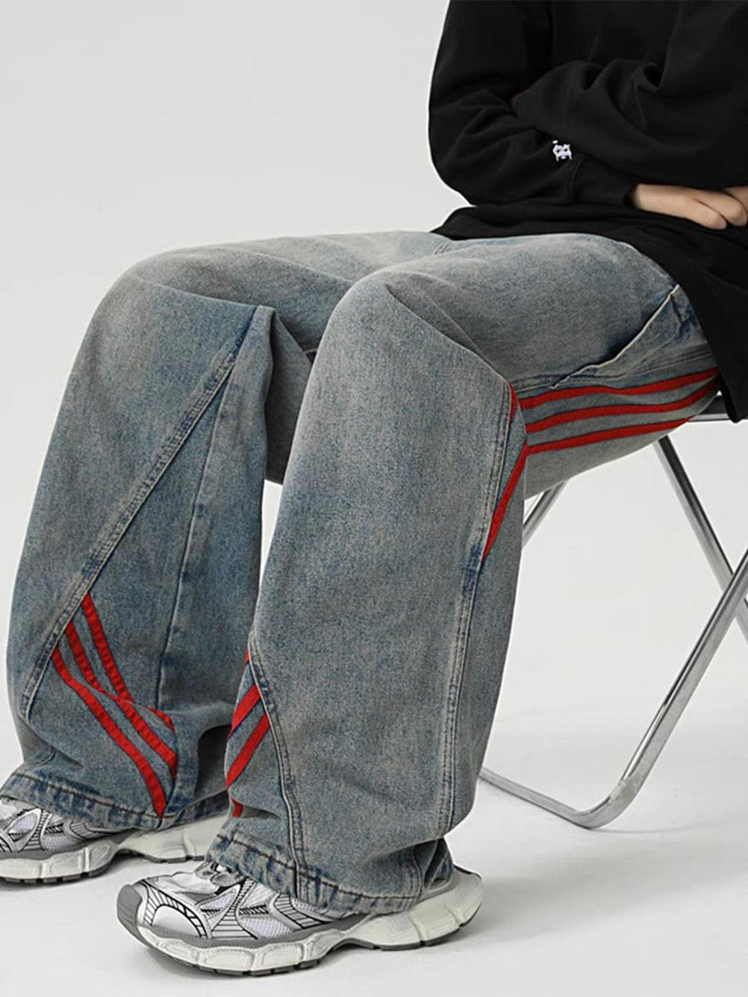 Wide-leg retro jeans with red accents by TALISHKO, styled casually for a laid-back look.