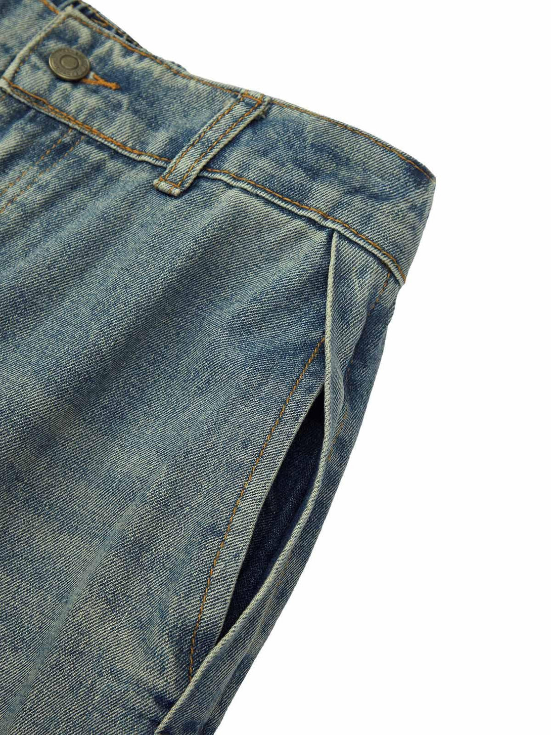 Close-up of TALISHKO's retro washed jeans, highlighting the unique pocket design and texture.