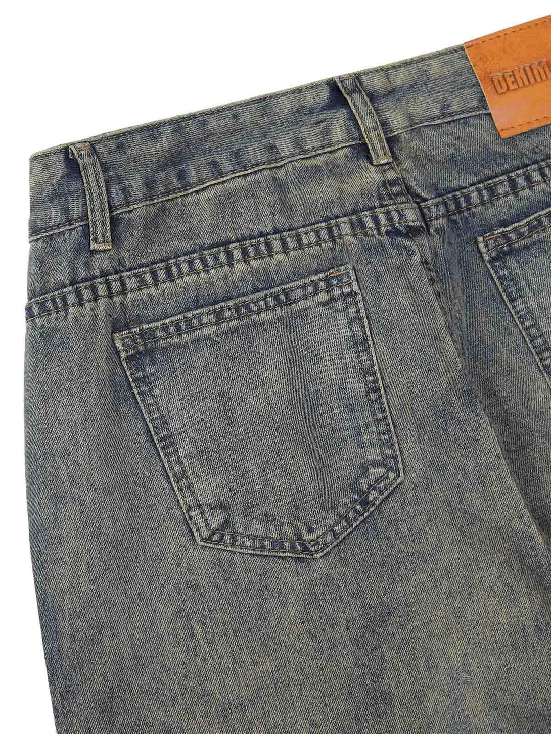 Back view of TALISHKO retro washed jeans, highlighting the pocket design and denim texture.