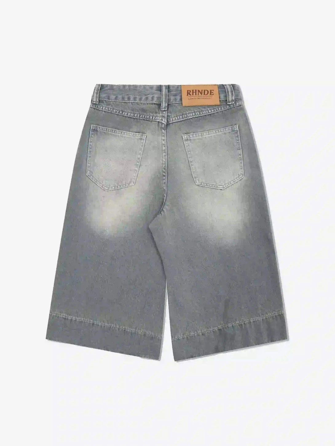 Back view of TALISHKO's retro denim jorts in a faded wash, highlighting casual summer style.