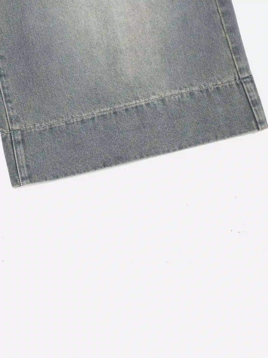 Detailed stitching on TALISHKO's retro cropped denim jorts, highlighting a classic vintage look.