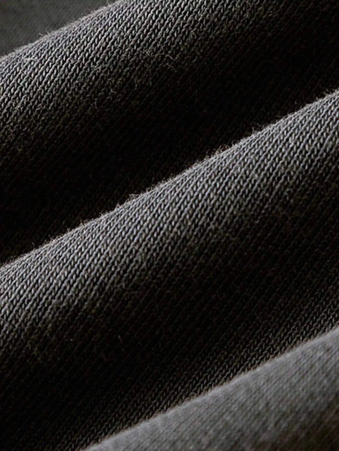 Detailed fabric and stitching of TALISHKO shorts, highlighting the textured material.