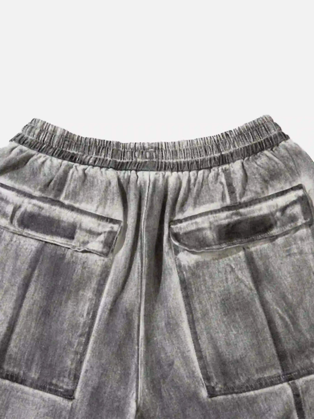 "Back detail of TALISHKO cargo shorts showing elastic waistband and large pockets."