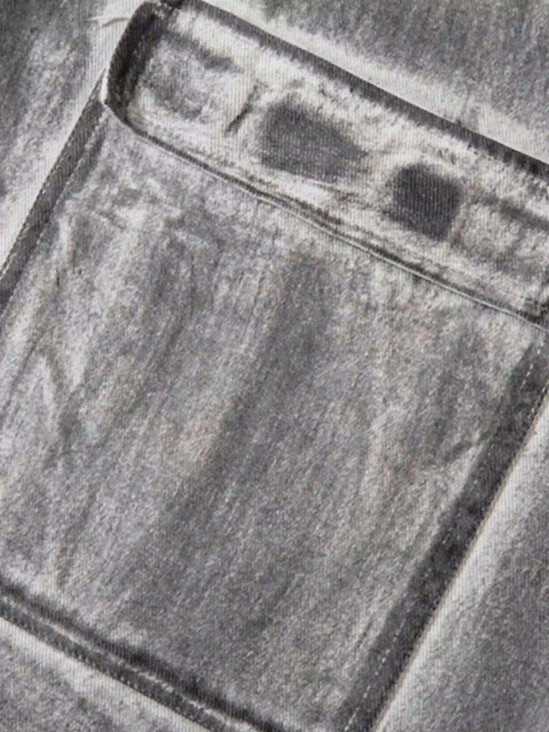 Intricate look at TALISHKO's distressed cargo shorts, highlighting the rugged pocket design.