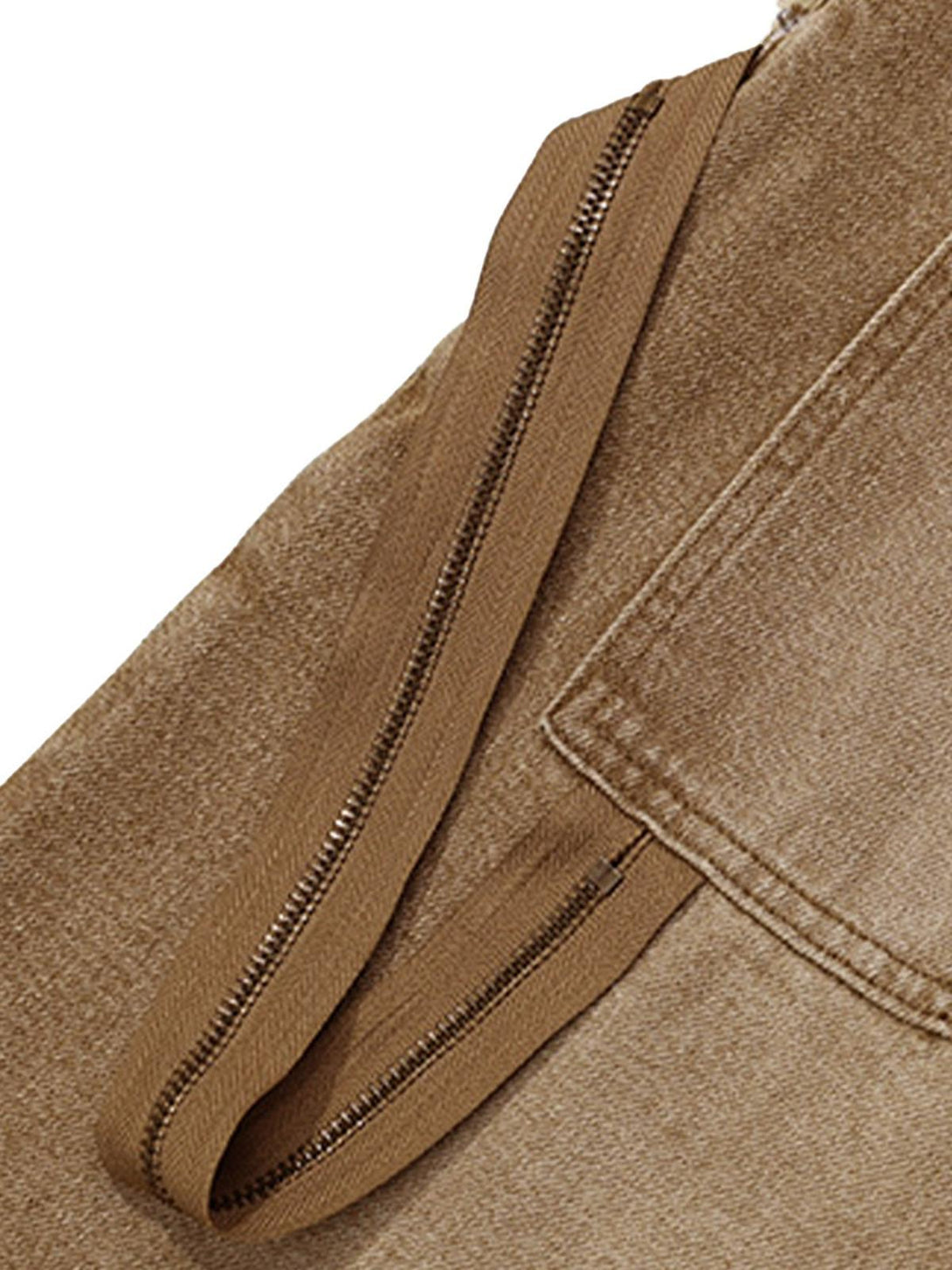 A detailed view of TALISHKO's retro denim shorts strap, highlighting the distressed texture.