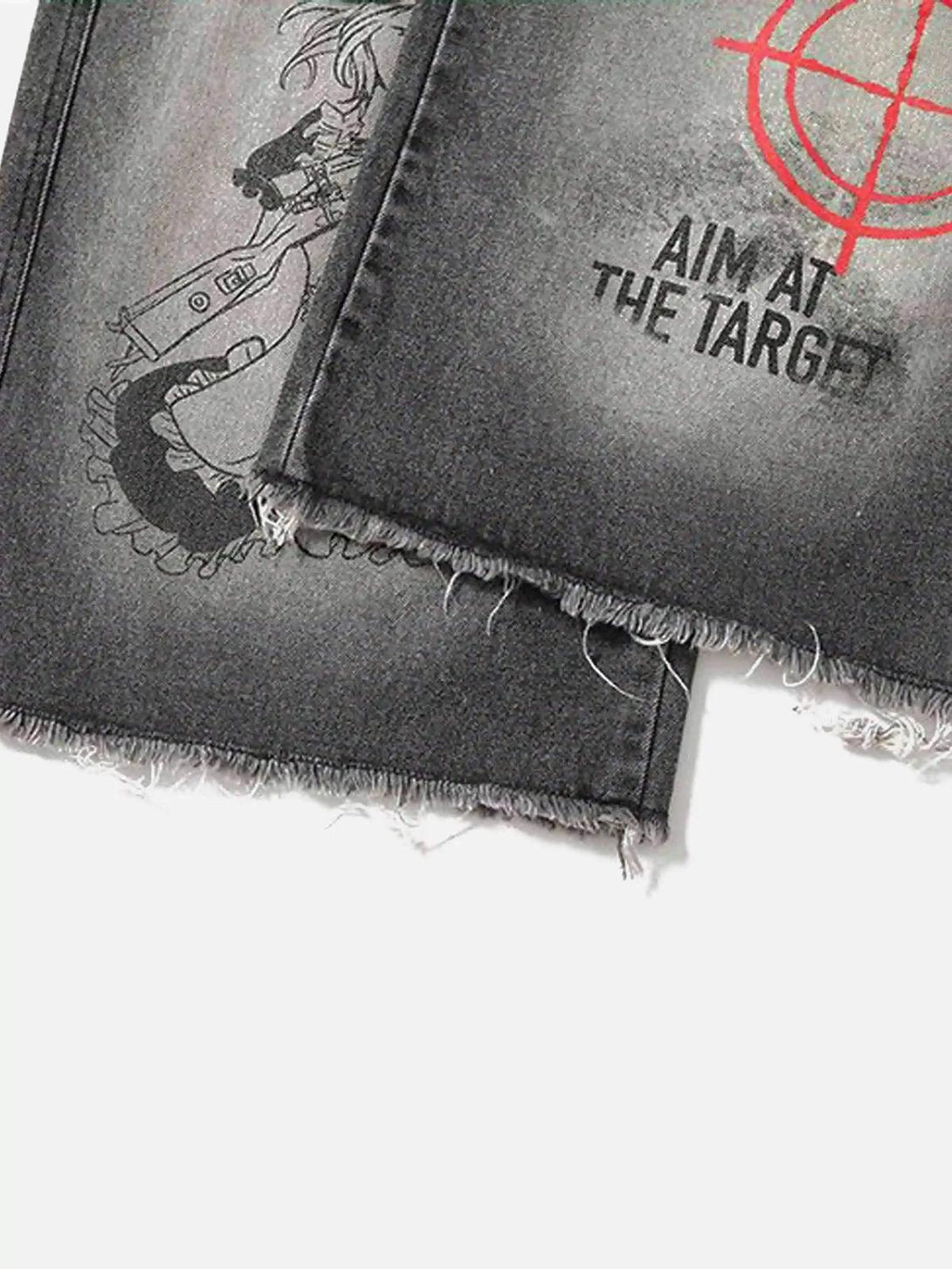 A tight crop highlighting TALISHKO jeans with bold red target embroidery and retro graphics.