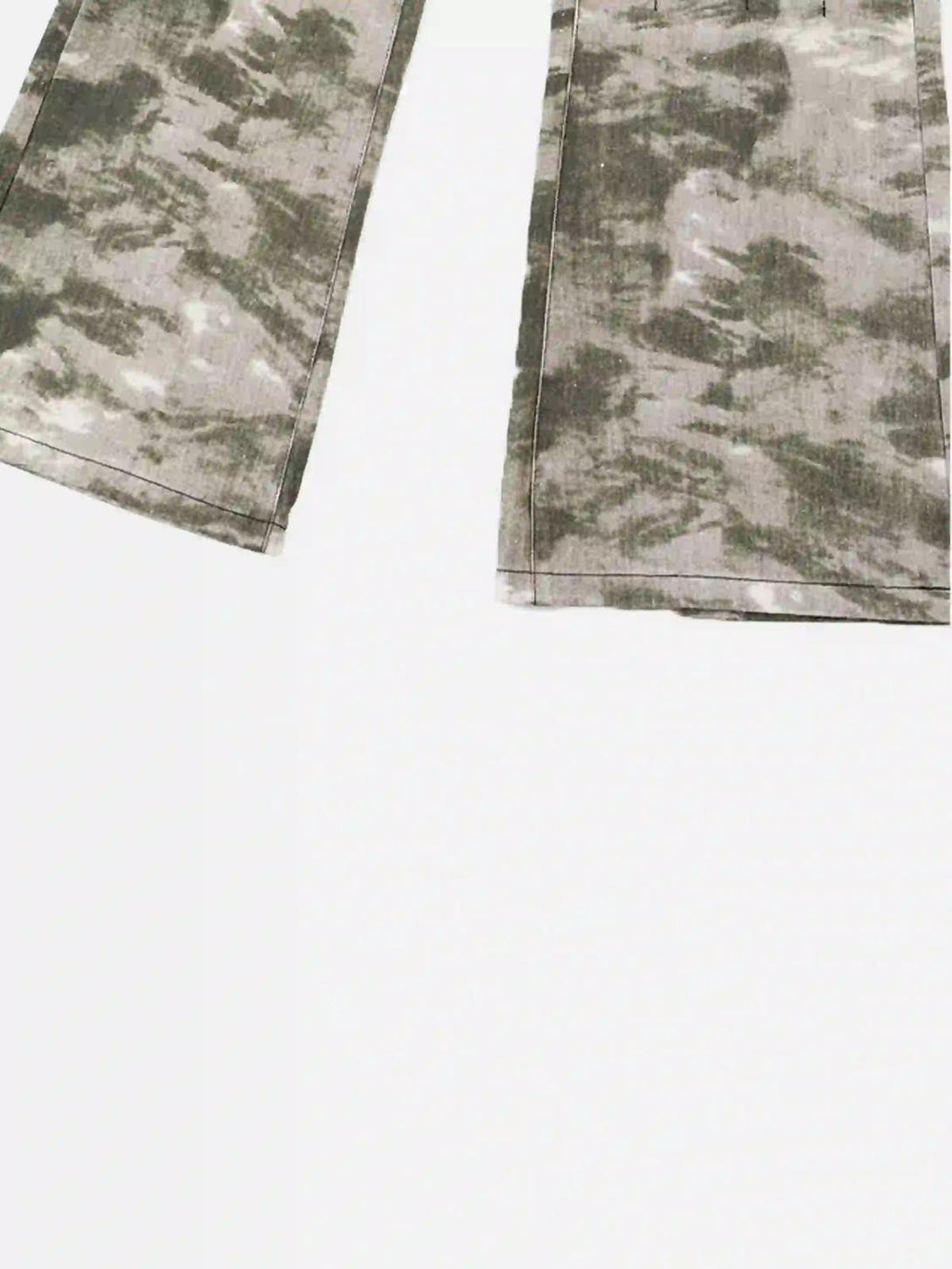 Focusing on the camouflage pattern of TALISHKO flared pants, highlighting retro street style.