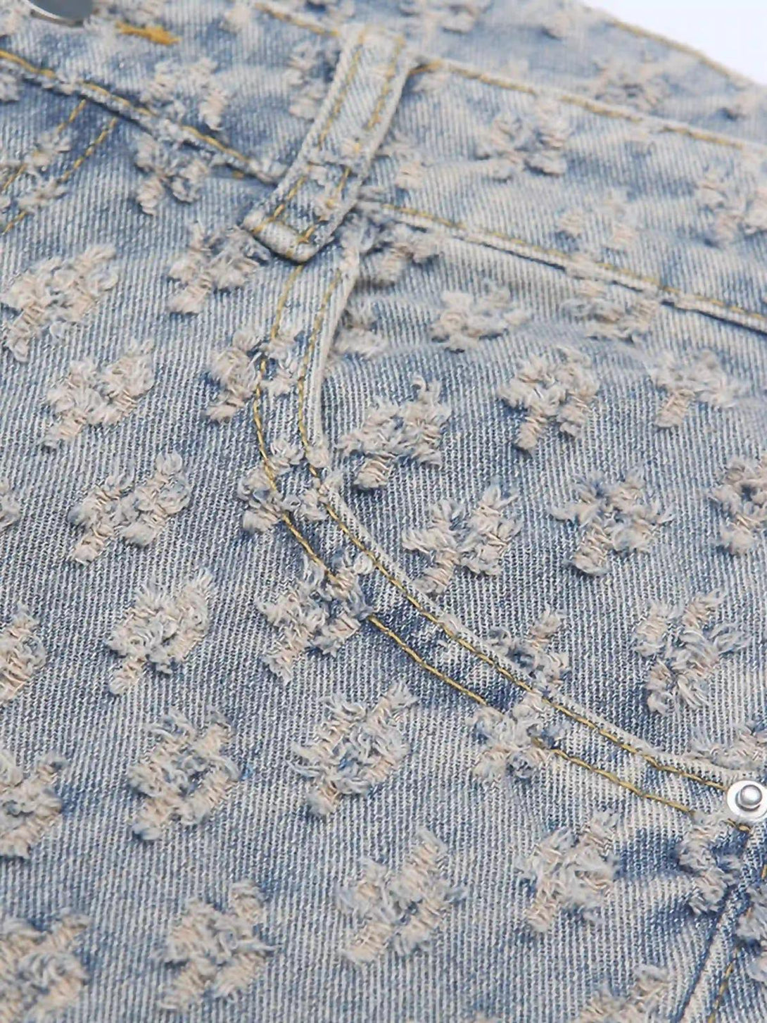 Detailed fabric and stitching of TALISHKO jeans, showcasing a retro floral texture.