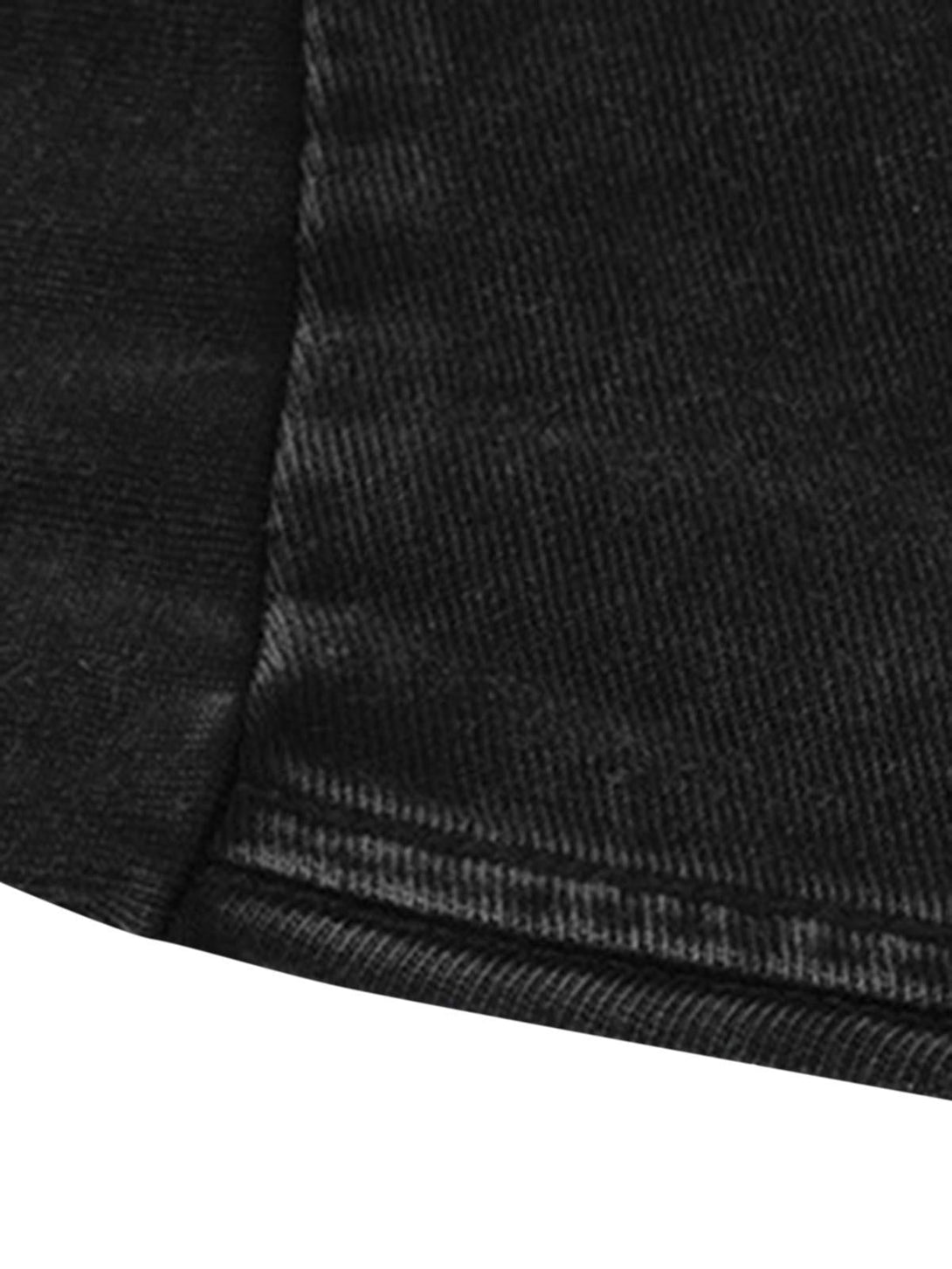 A tight crop highlighting the hem and texture of a black TALISHKO street-style T-shirt.