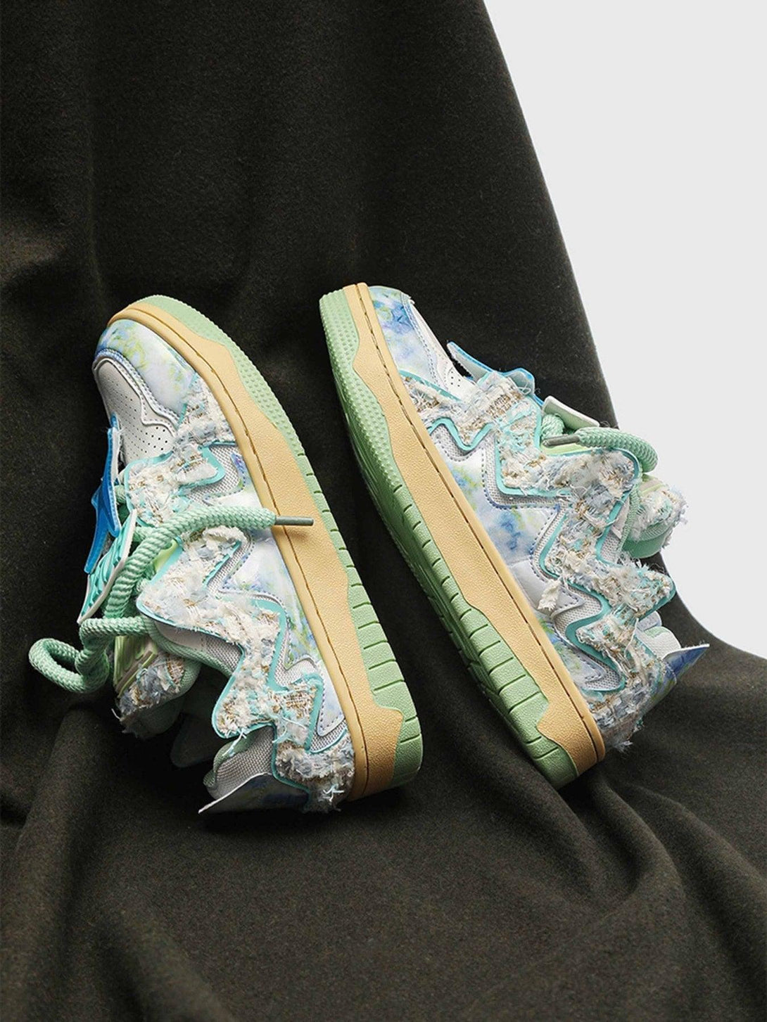 TALISHKO sneakers with pastel hues and textured details, highlighting a unique street style flair.